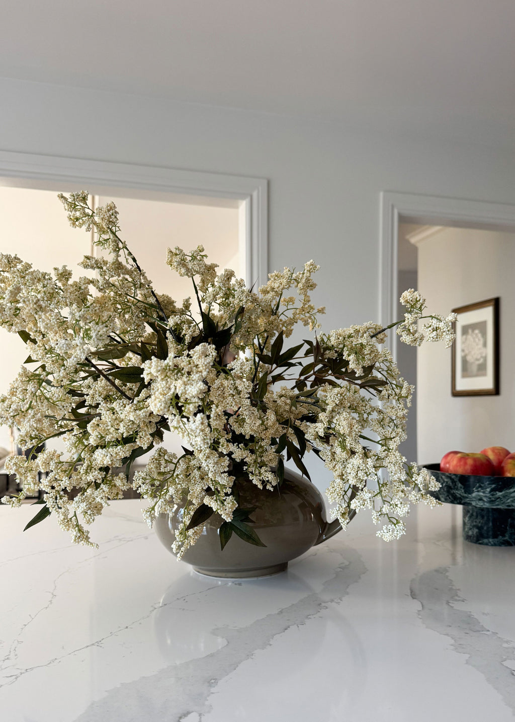 Creams Plum Berry Branches Styled in a Tan Vase