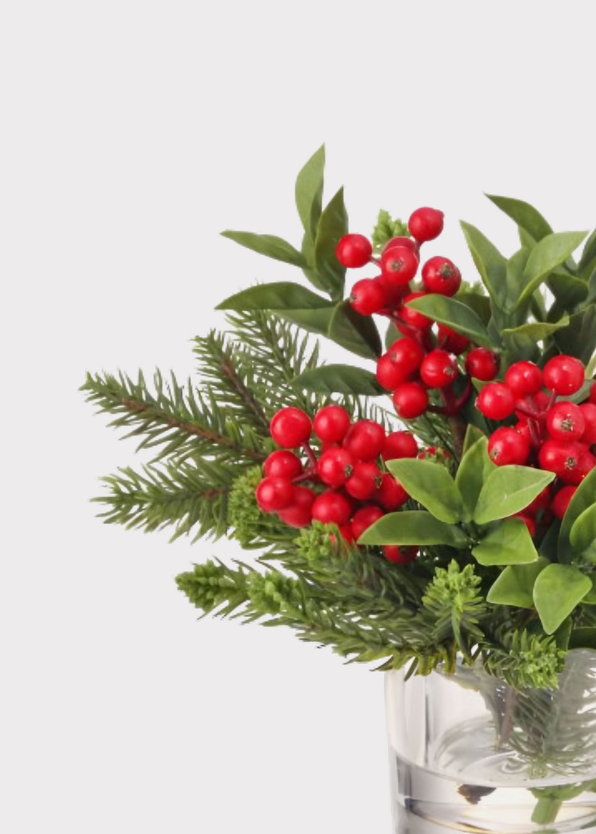 Close-up of a Christmas Pine and Red Berry Arrangement