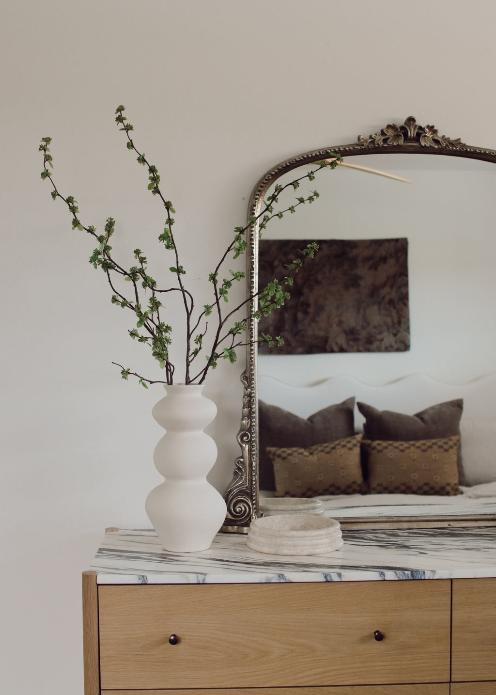 decorative vase with artificial branch with green buds