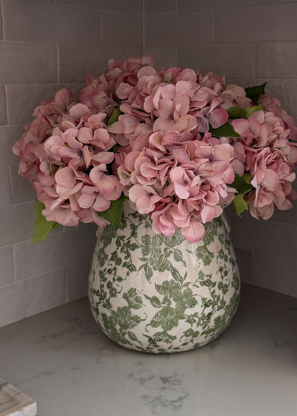 pink hydrangeas styled in a vase