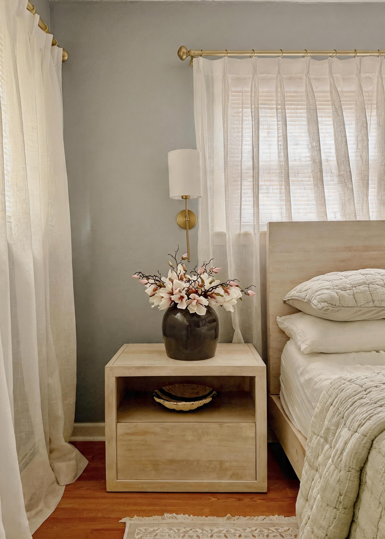 Bedroom with magnolias on the nightstand
