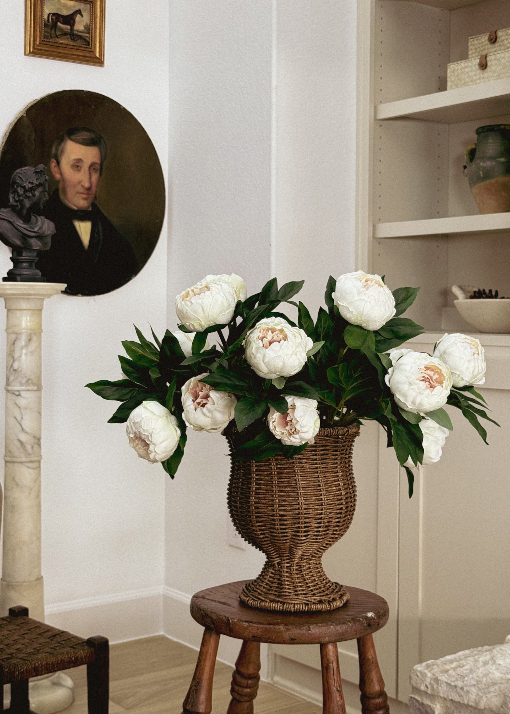 artificial cream peony flowers arranged in a vase