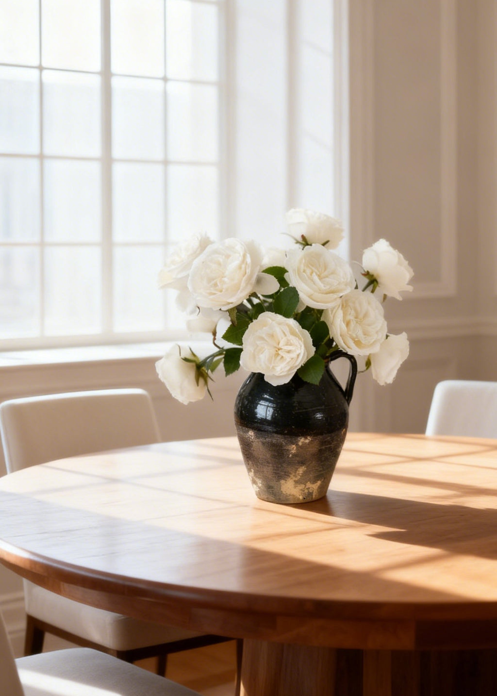 White silk roses in a vase