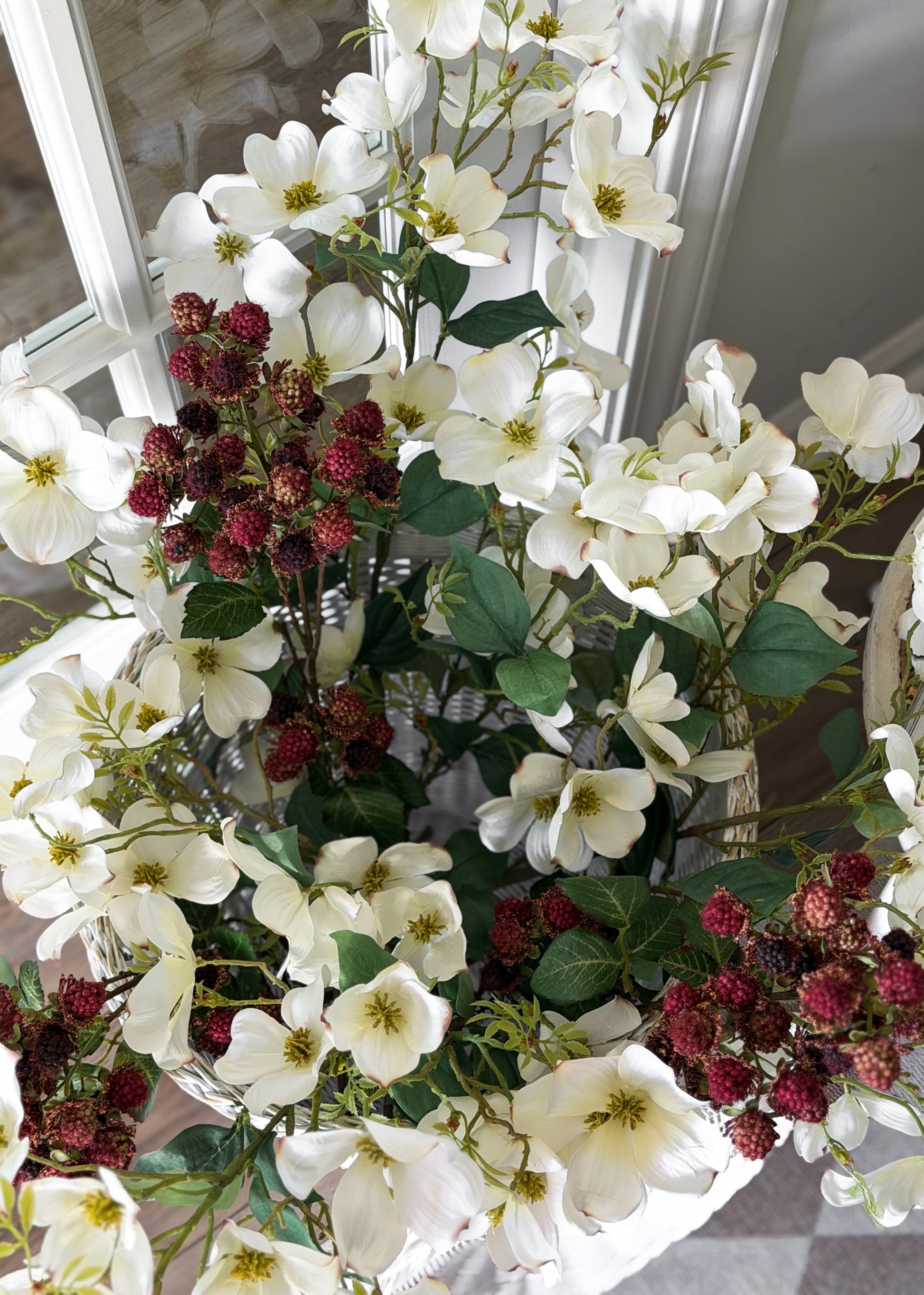 Bouquet of white dogwood flowers and red raspberries