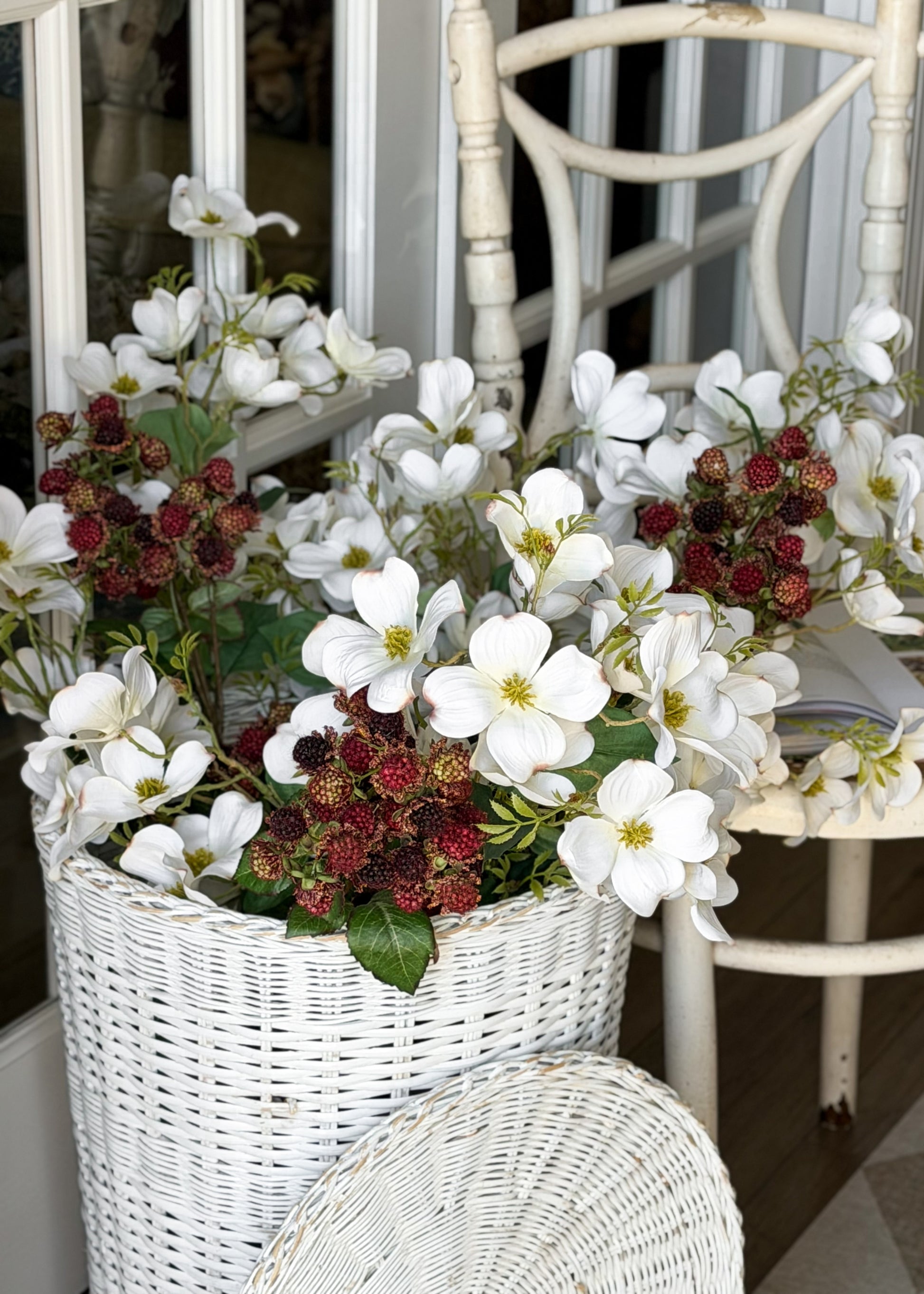 artificial dogwood flowers and raspberries