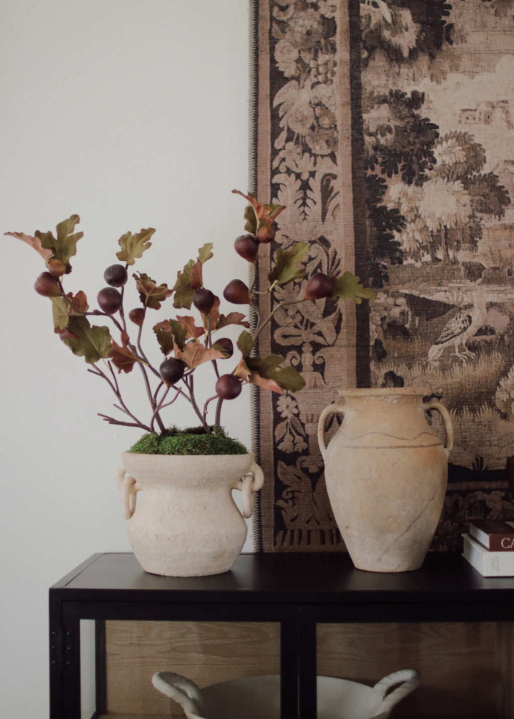 artificial figs arranged in a vase