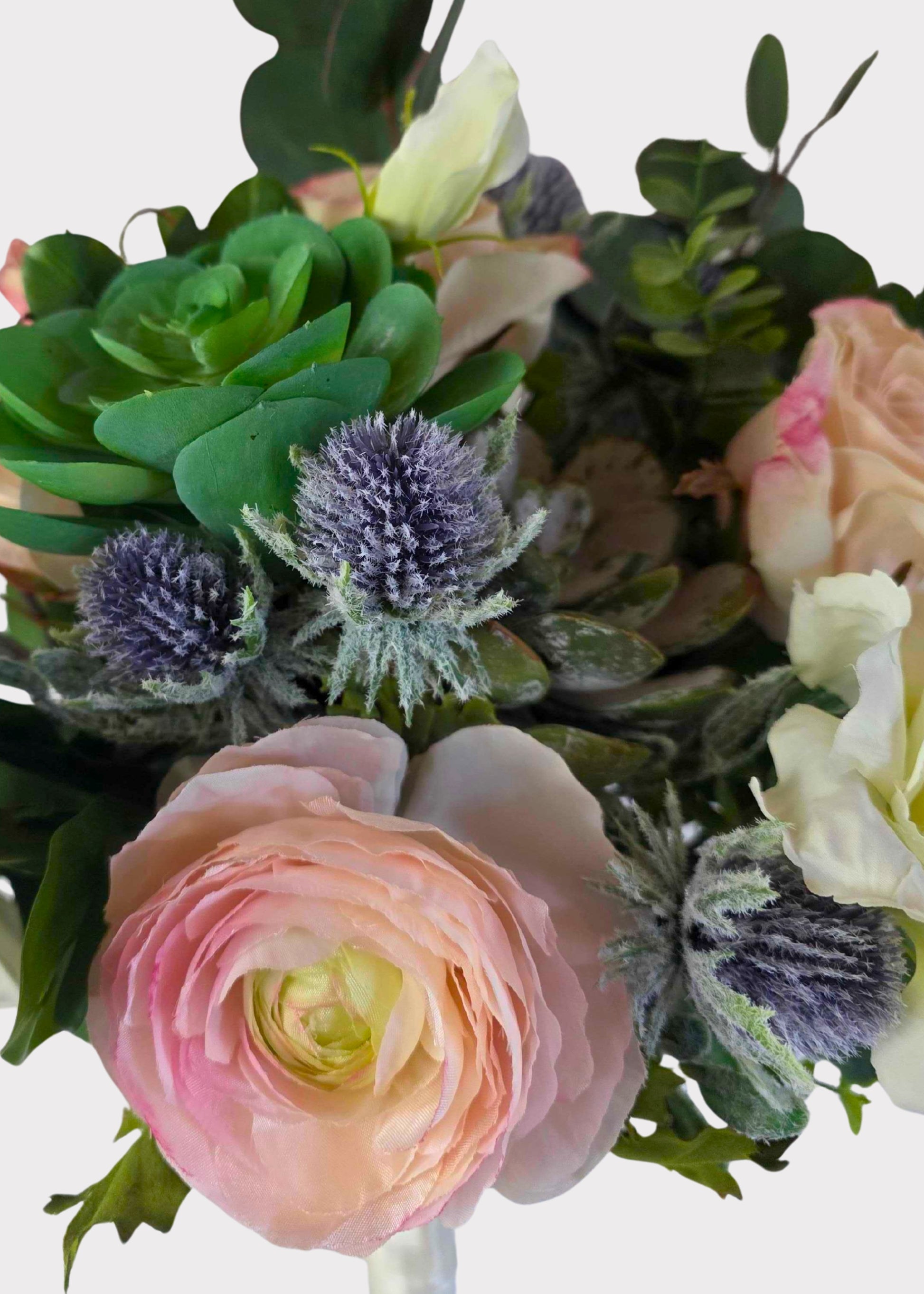 artificial rose and succulent bouquet