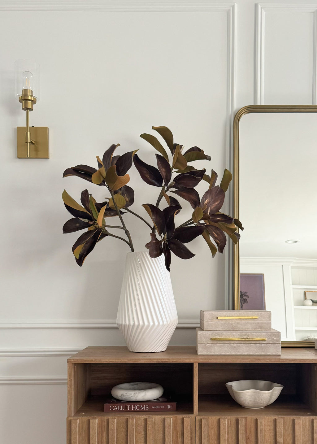 vase styled with brown magnolia leaf branches