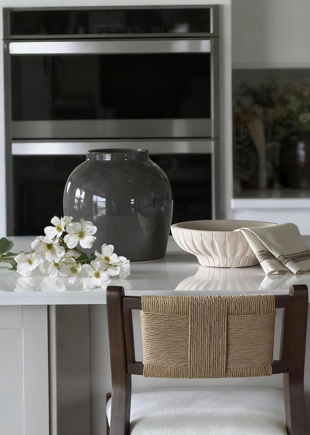 slate gray vase and faux dogwood stem