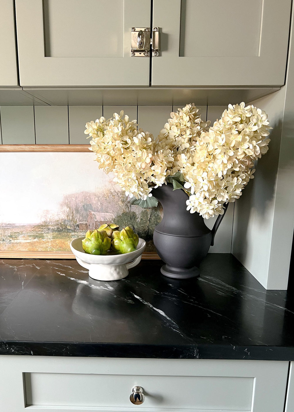 large cream cone hydrangeas in a pitcher vase
