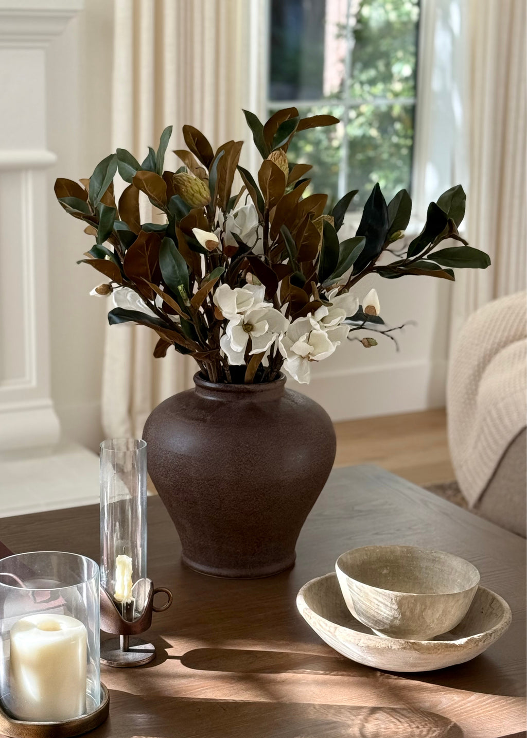 Decorative stoneware vase of faux magnolias