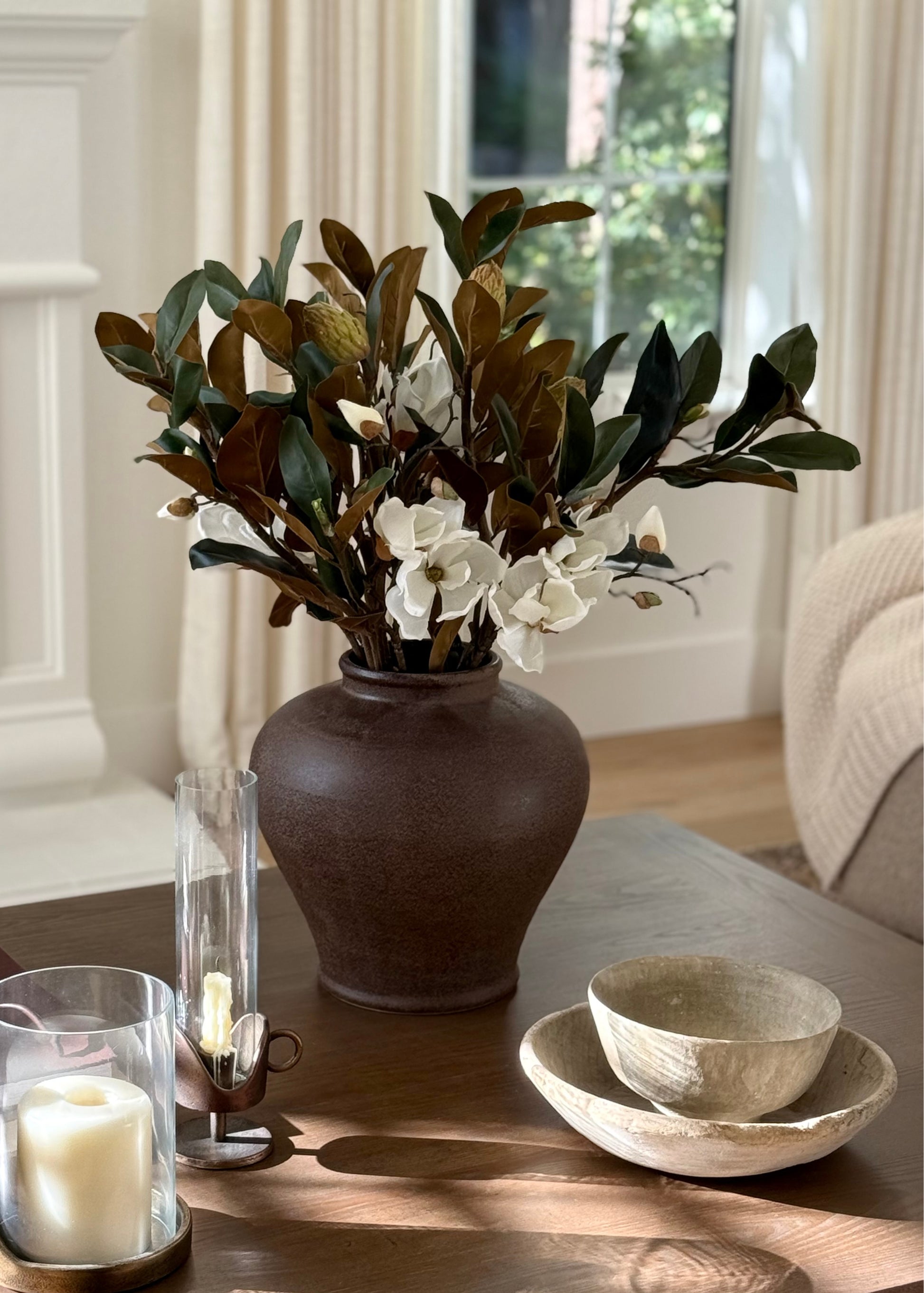 Decorative stoneware vase of faux magnolias