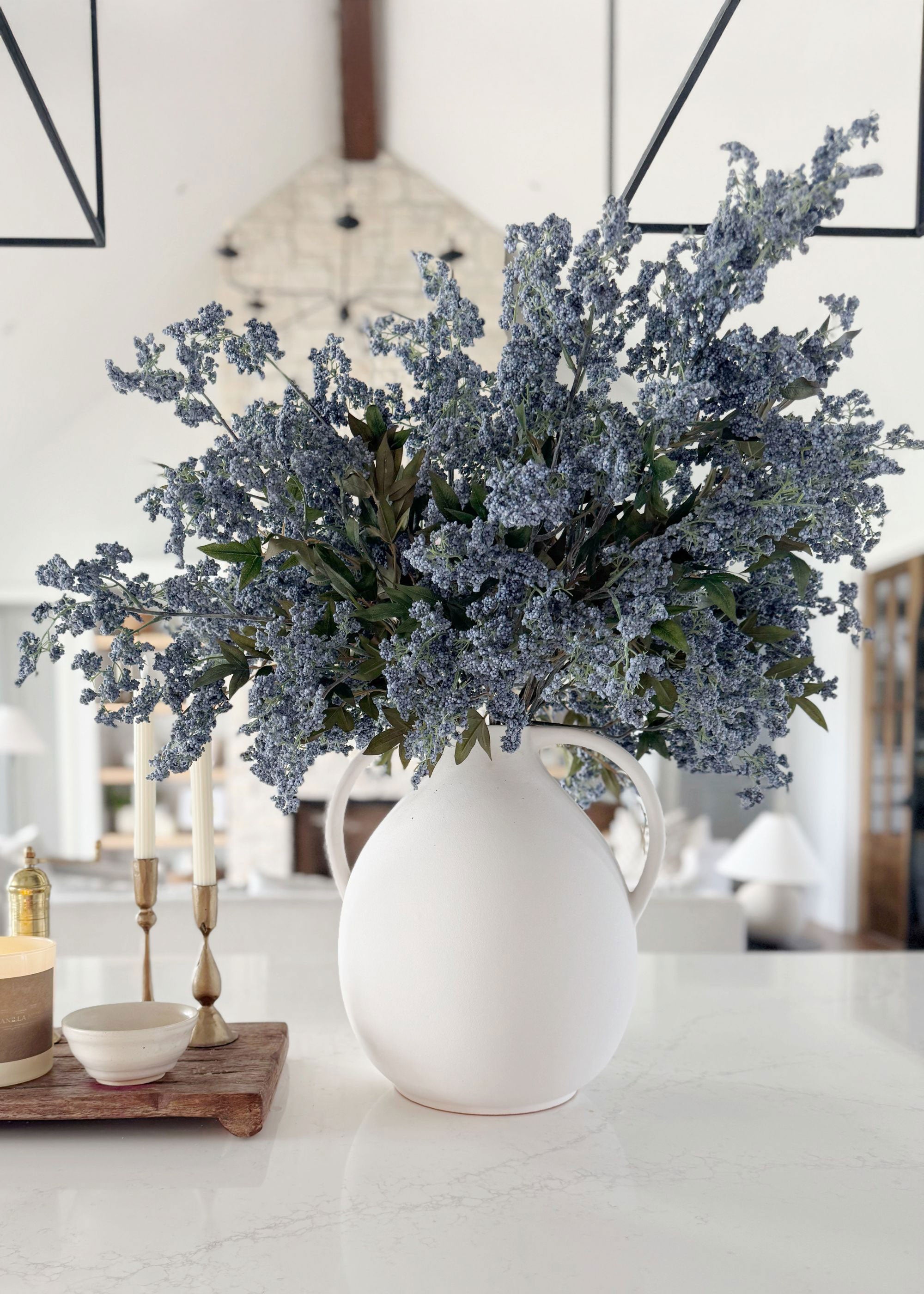 Afloral white jug vase with blue plum berry flowers 