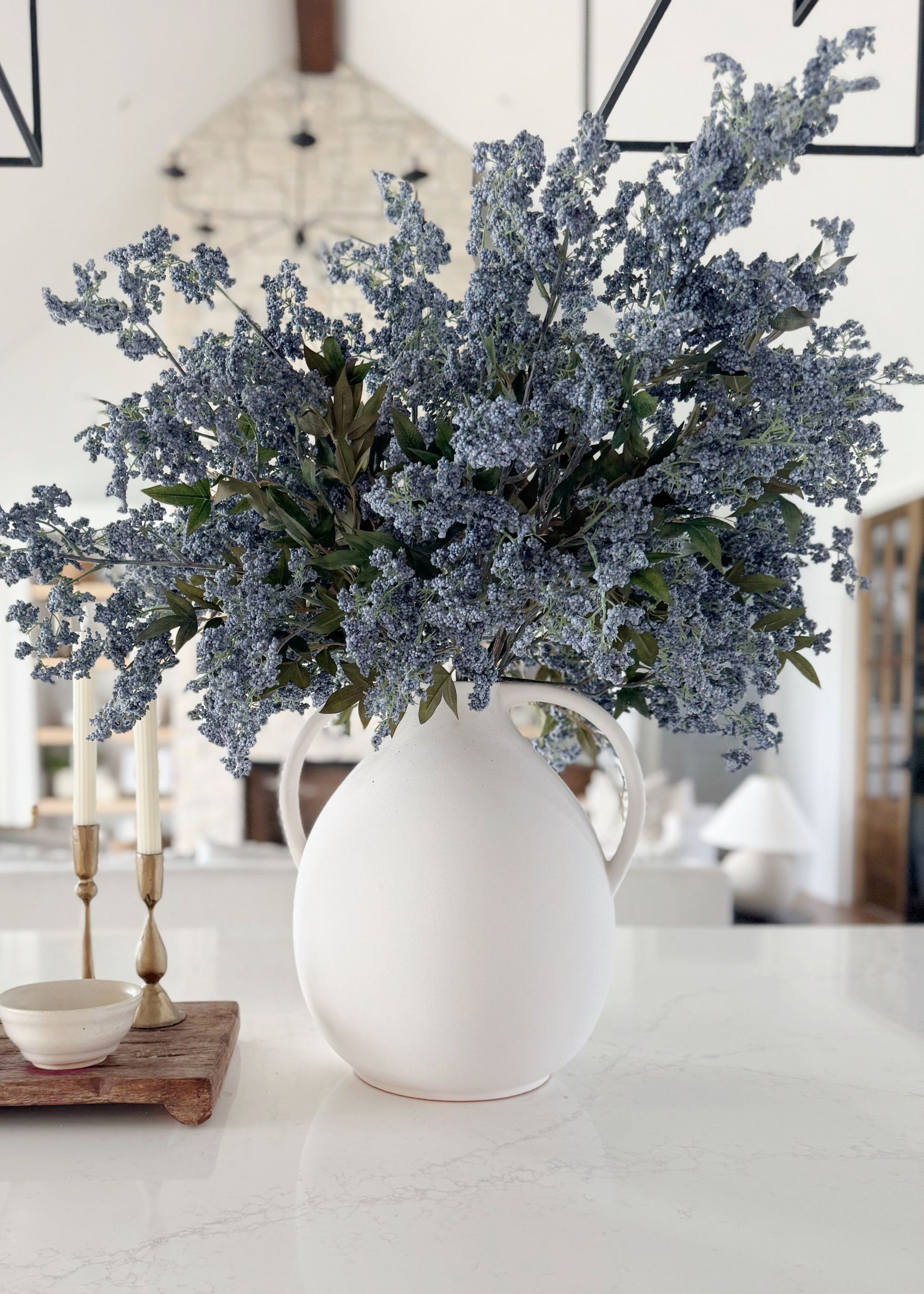 Afloral white jug vase with blue plum berry flowers 