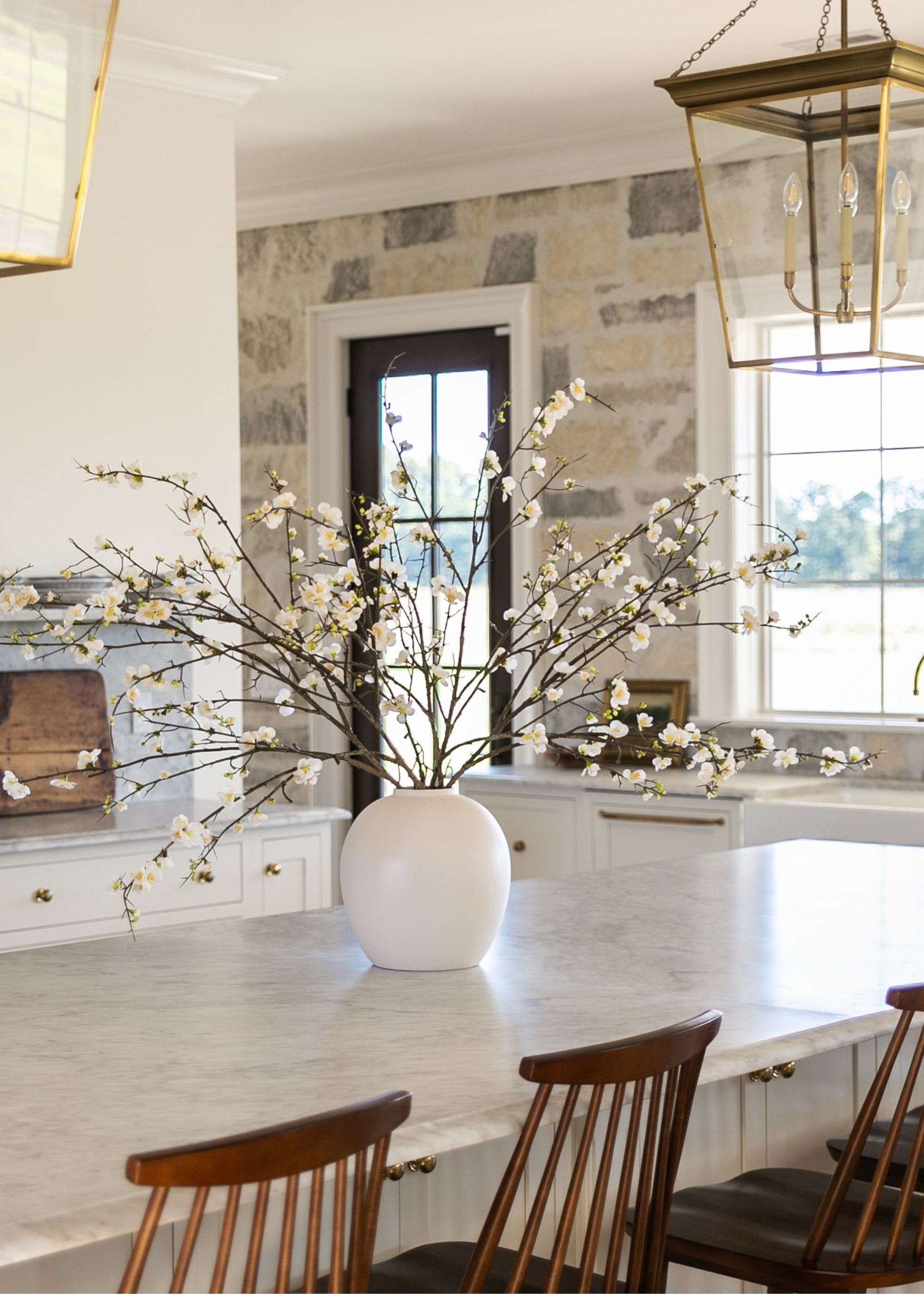 Artificial Spring blossoms arranged in the Afloral cream vase