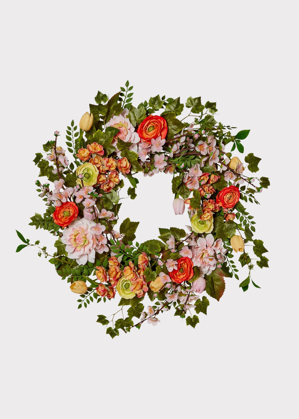 Fake garden wreath with ranunculus, dahlias, and blossoms