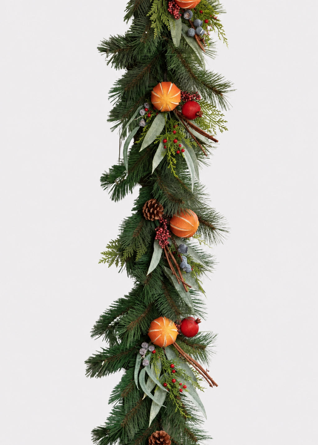 artificial evergreen garland with faux dried fruit and pine cones