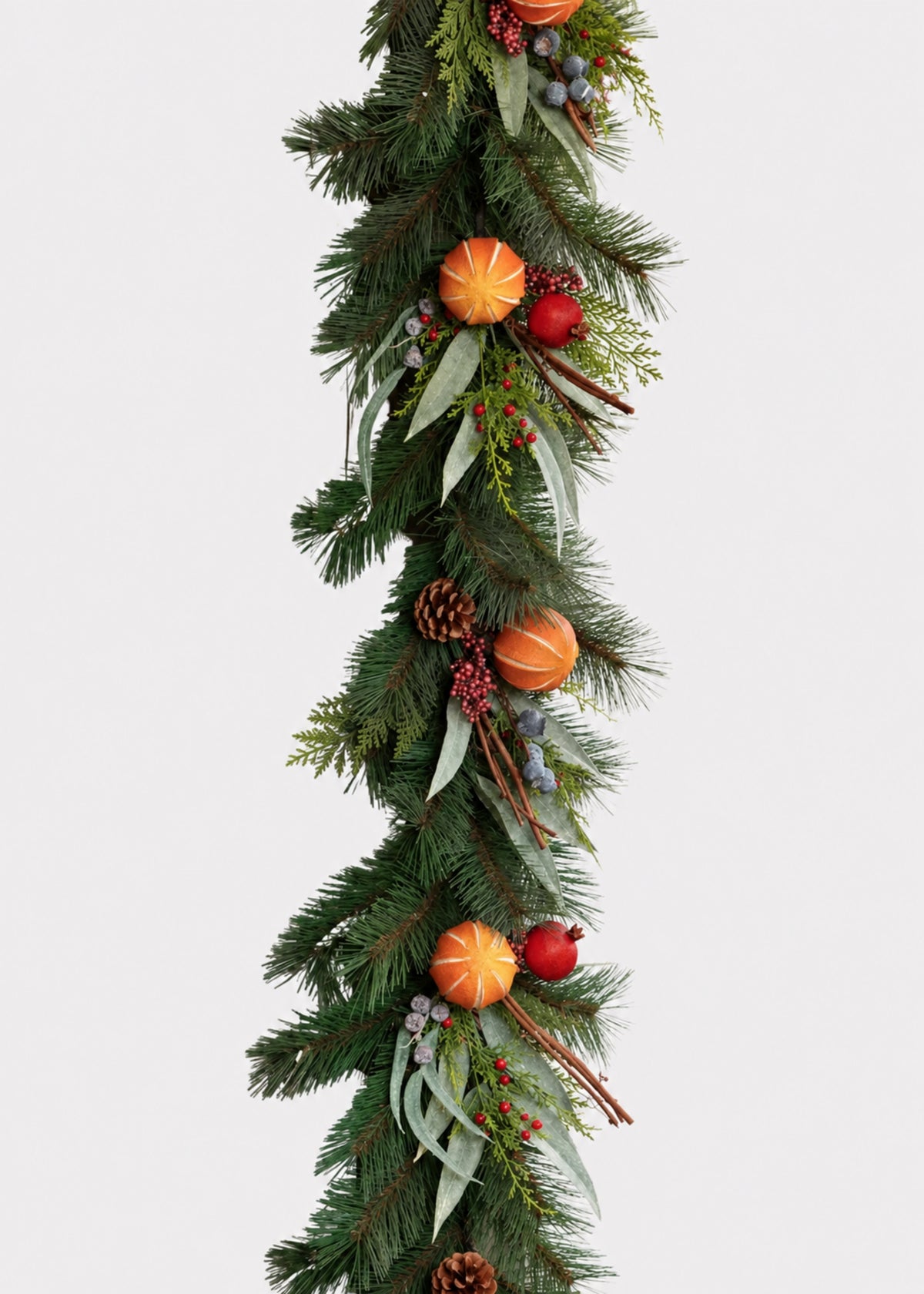 artificial evergreen garland with faux dried fruit and pine cones