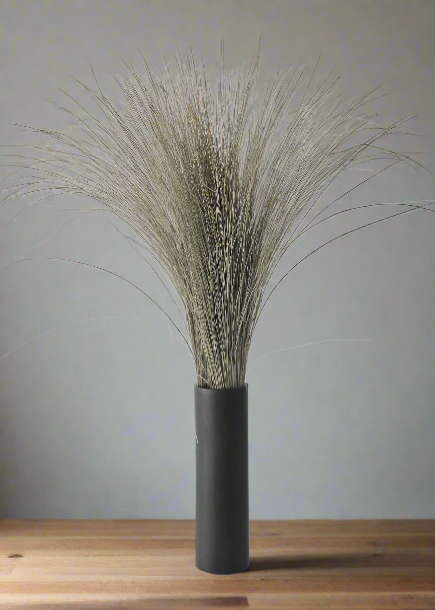 Black vase with dried grasses 