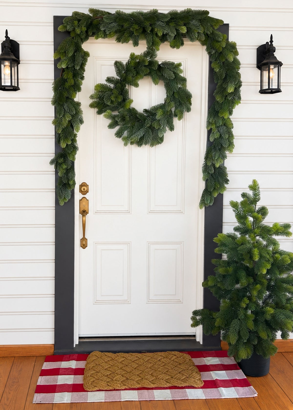 Princess Pine Garland, Wreath, and Tree Syling a Porch