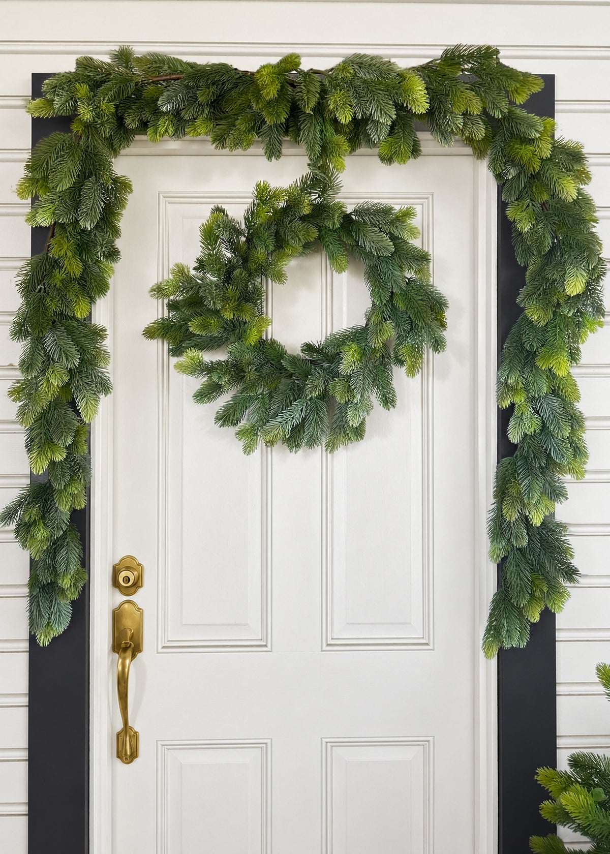 Princess Pine Garland and Wreath Hanging on a Door