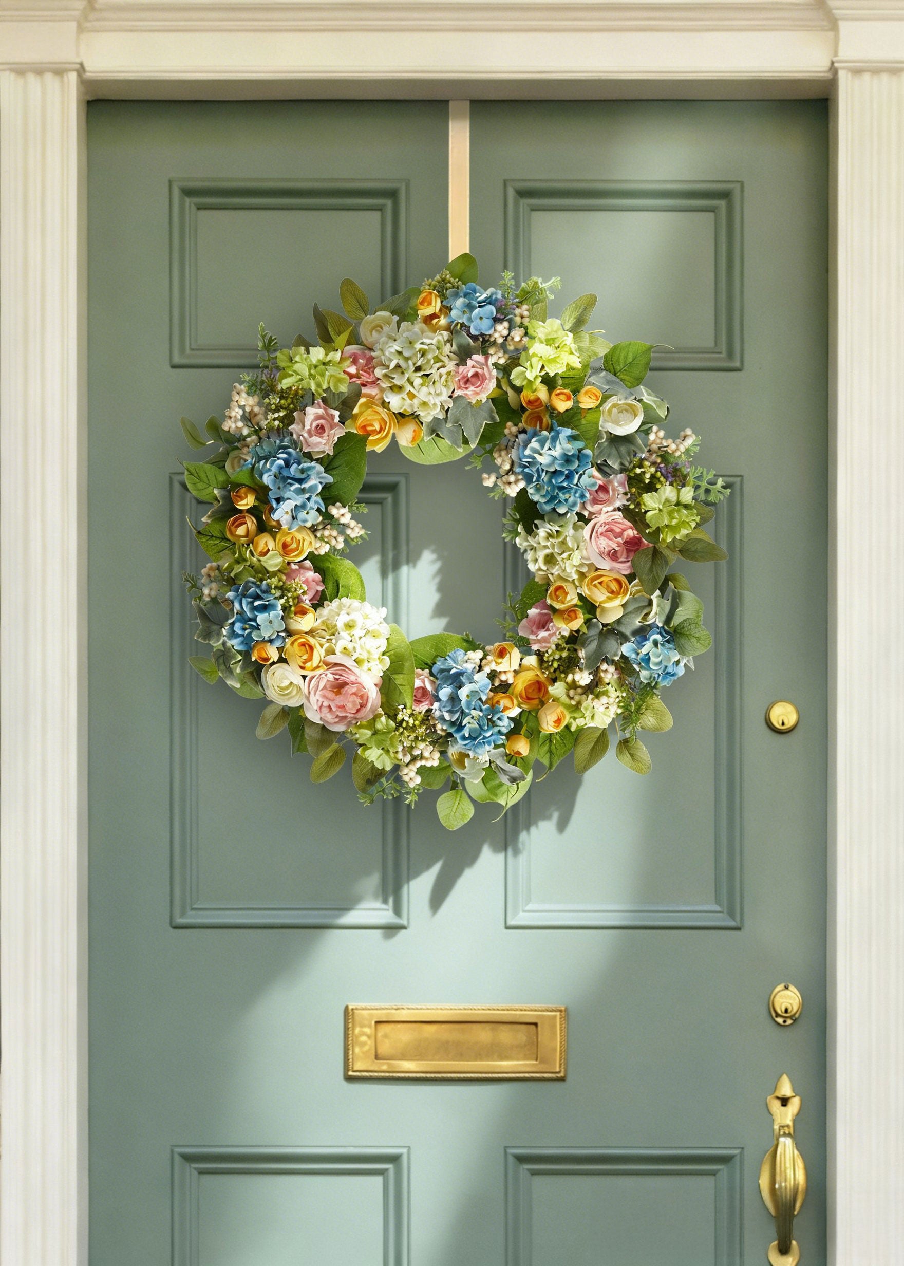 Artificial Spring Blooming Wreath on a Green Door