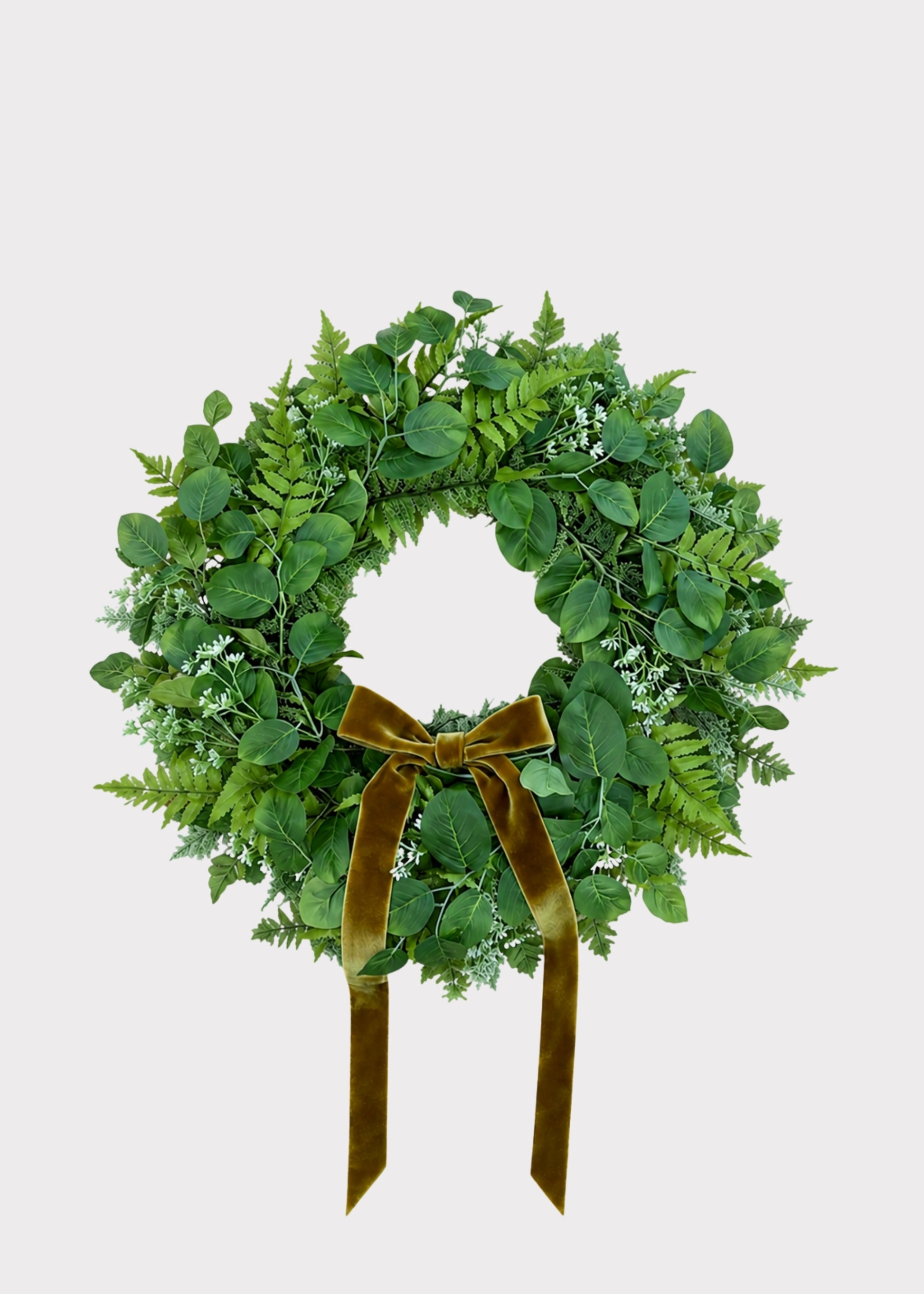 Artificial foliage wreath with bow
