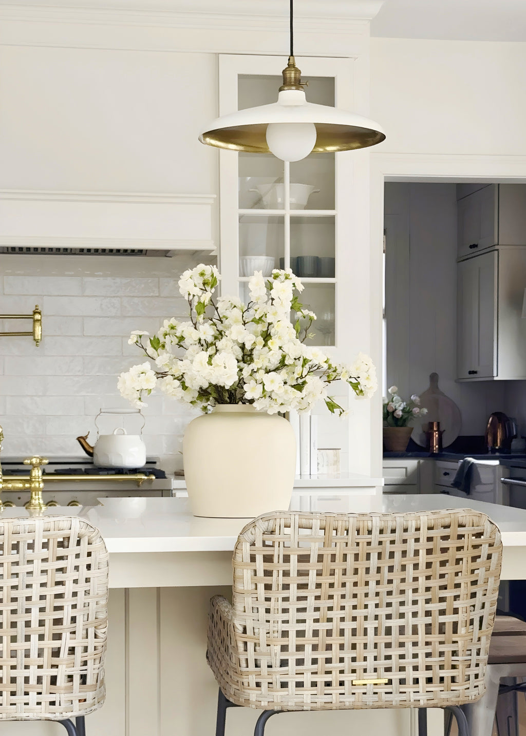 silk cherry blossom arrangement on counter