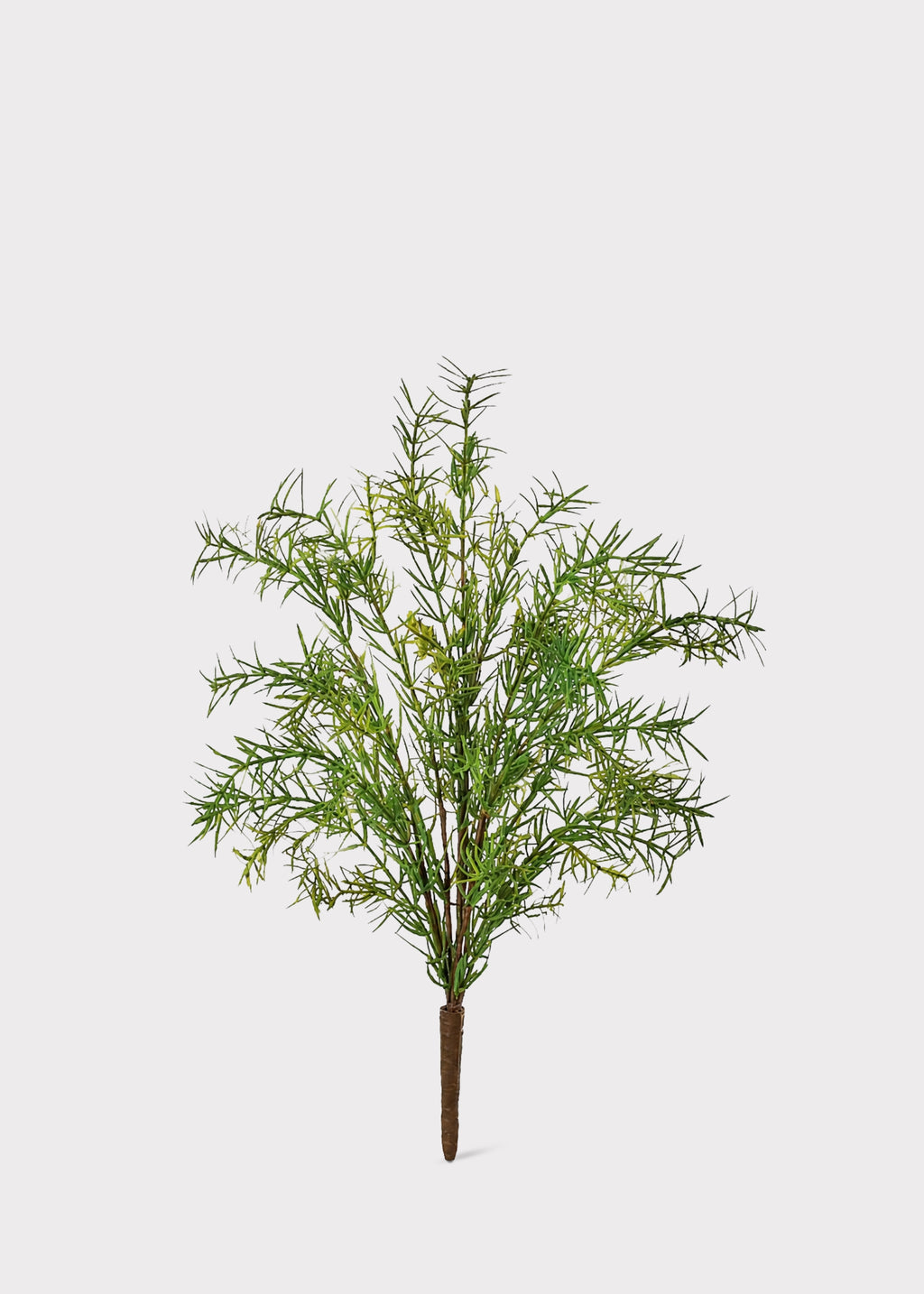 An artificial green foliage tree branch with a brown stem, isolated on a light gray background.