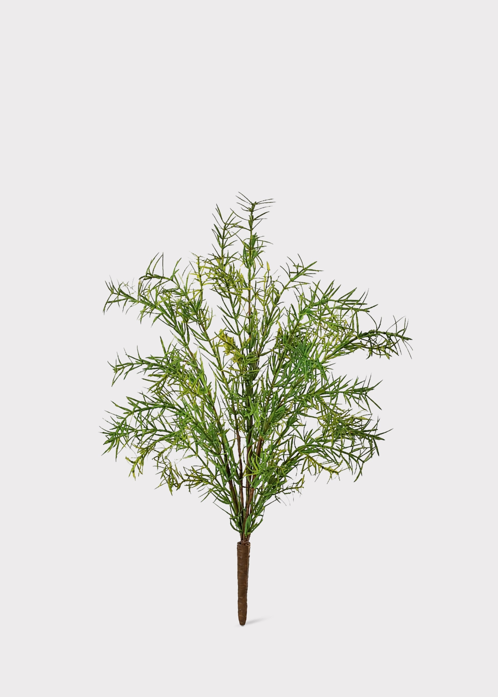 An artificial green foliage tree branch with a brown stem, isolated on a light gray background.