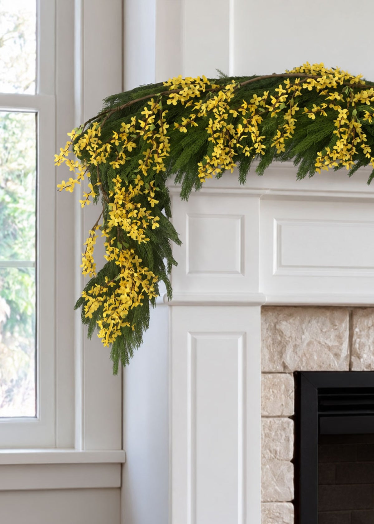 norfolk and forsythia garland on a mantel