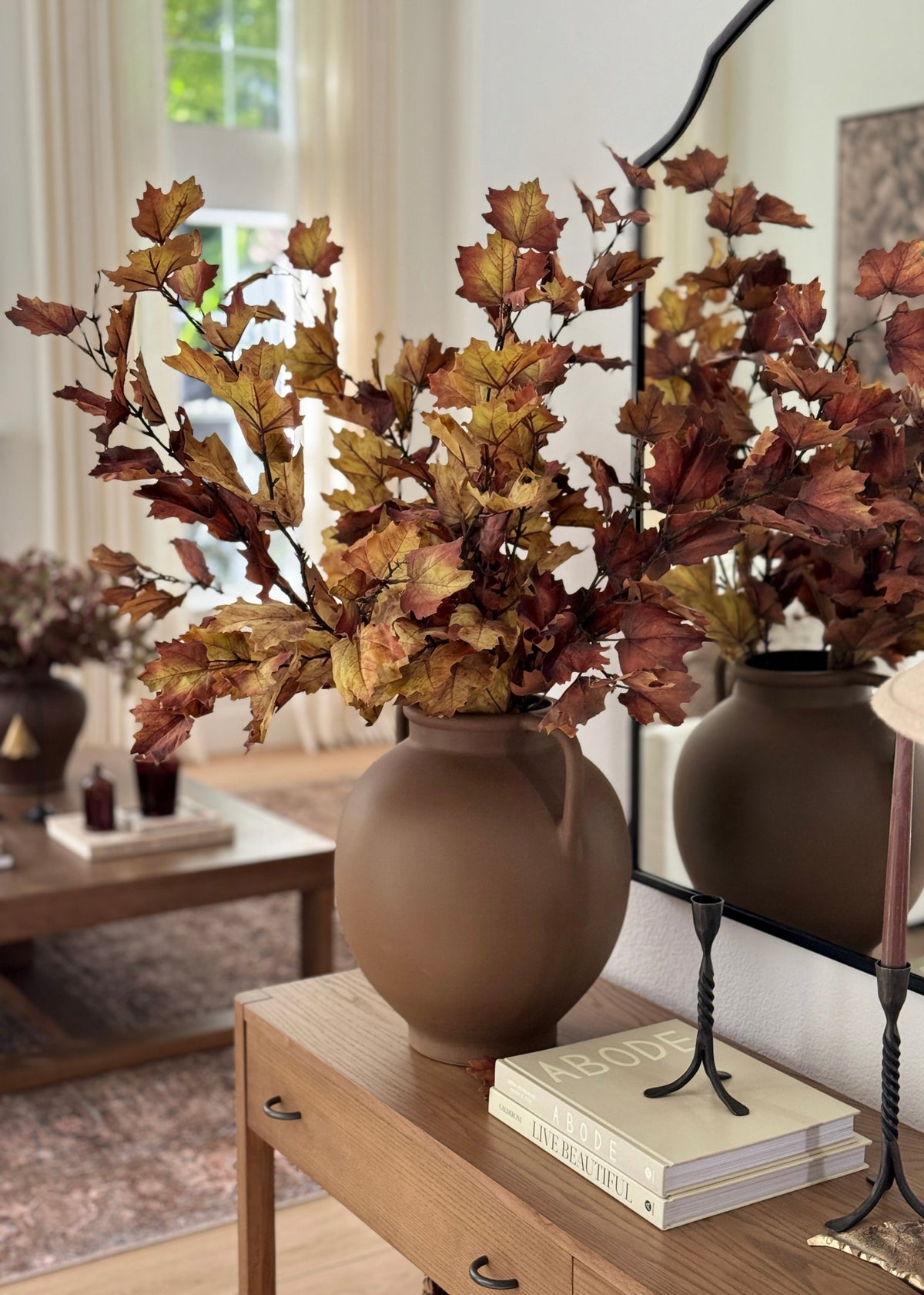 artificial maple leaves styled in a vase