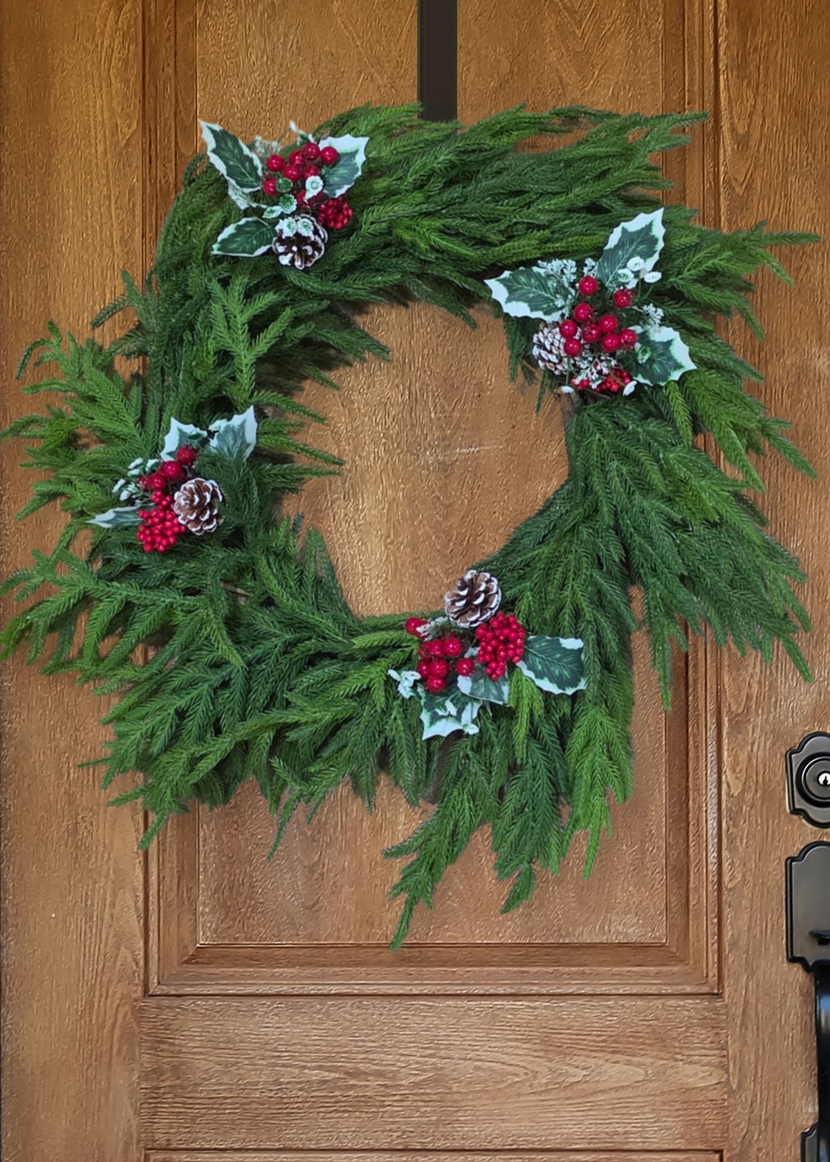 Fake Berry and Pine Cone Picks on a Norfolk Pine Wreath