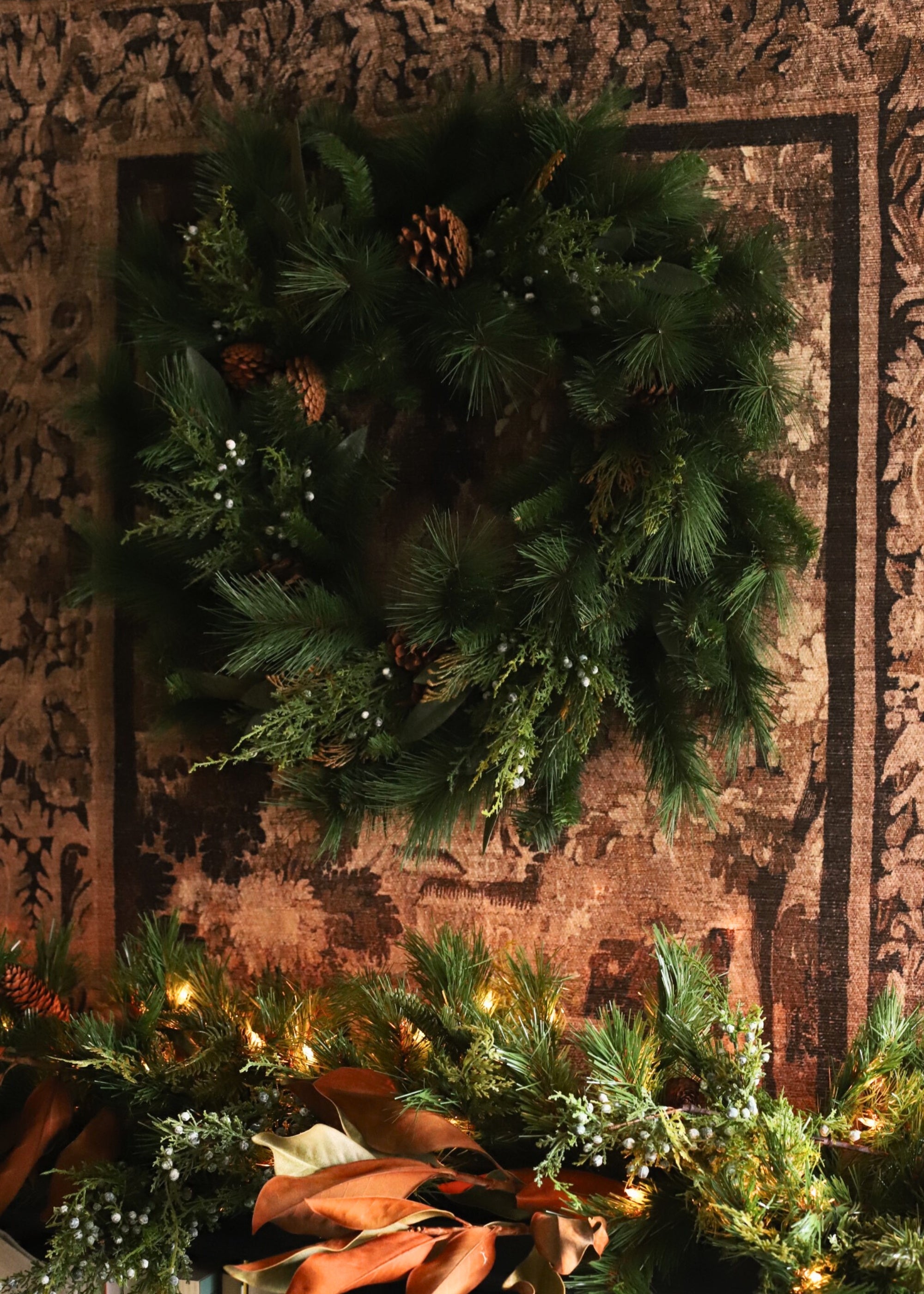 Artificial Juniper and Cedar Winter Wreath hung over mantel