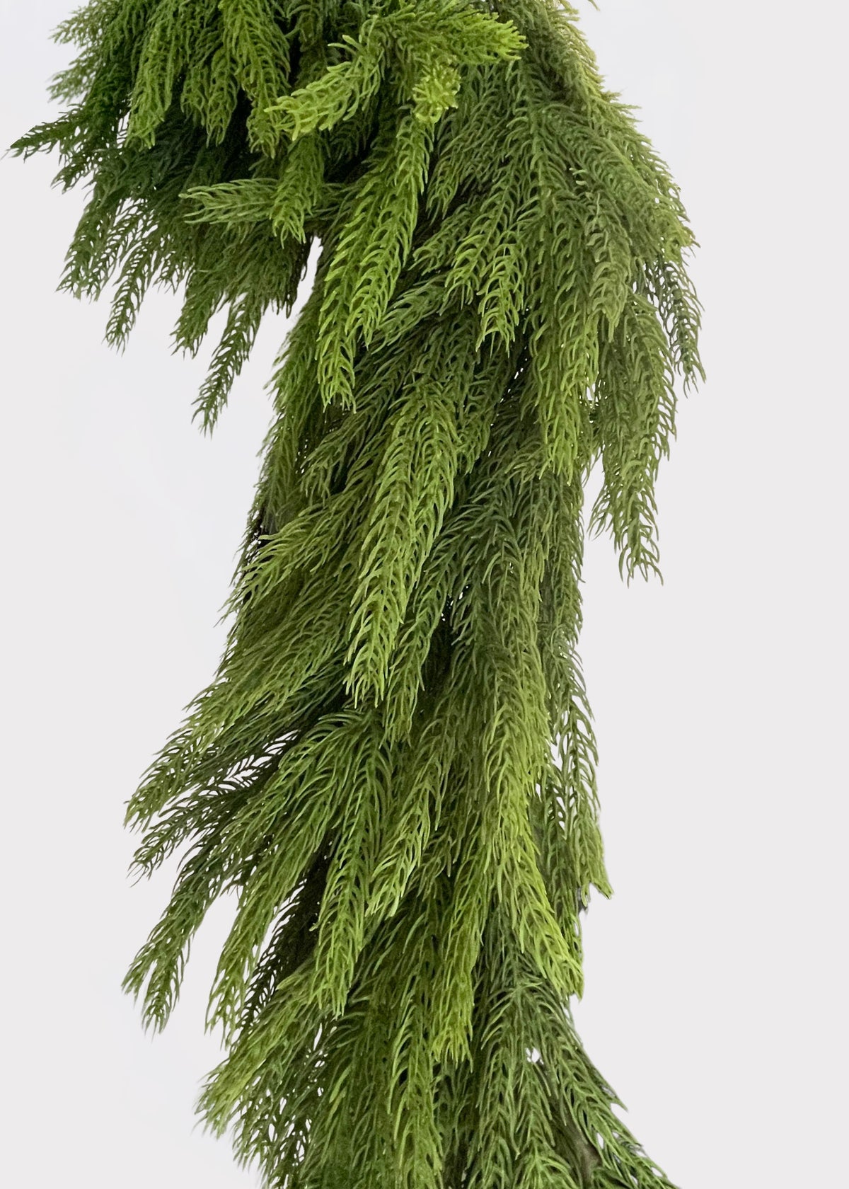 Close-up of the Afloral™ Real Touch Norfolk Pine Deluxe Forest Garland