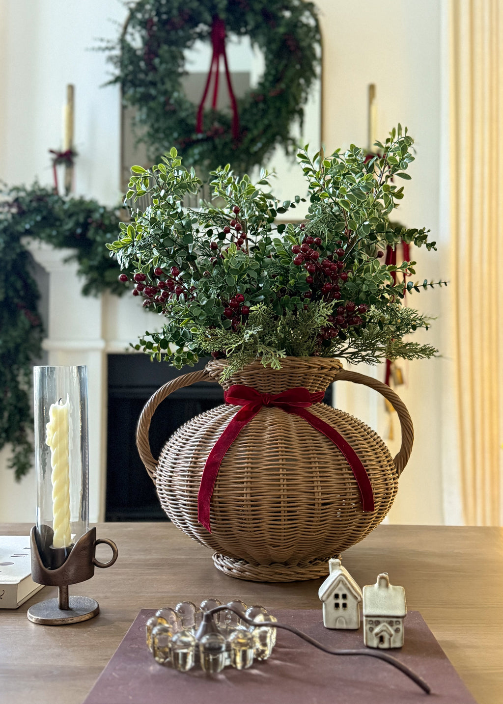 christmas greenery arrangement with eucalyptus and red berries