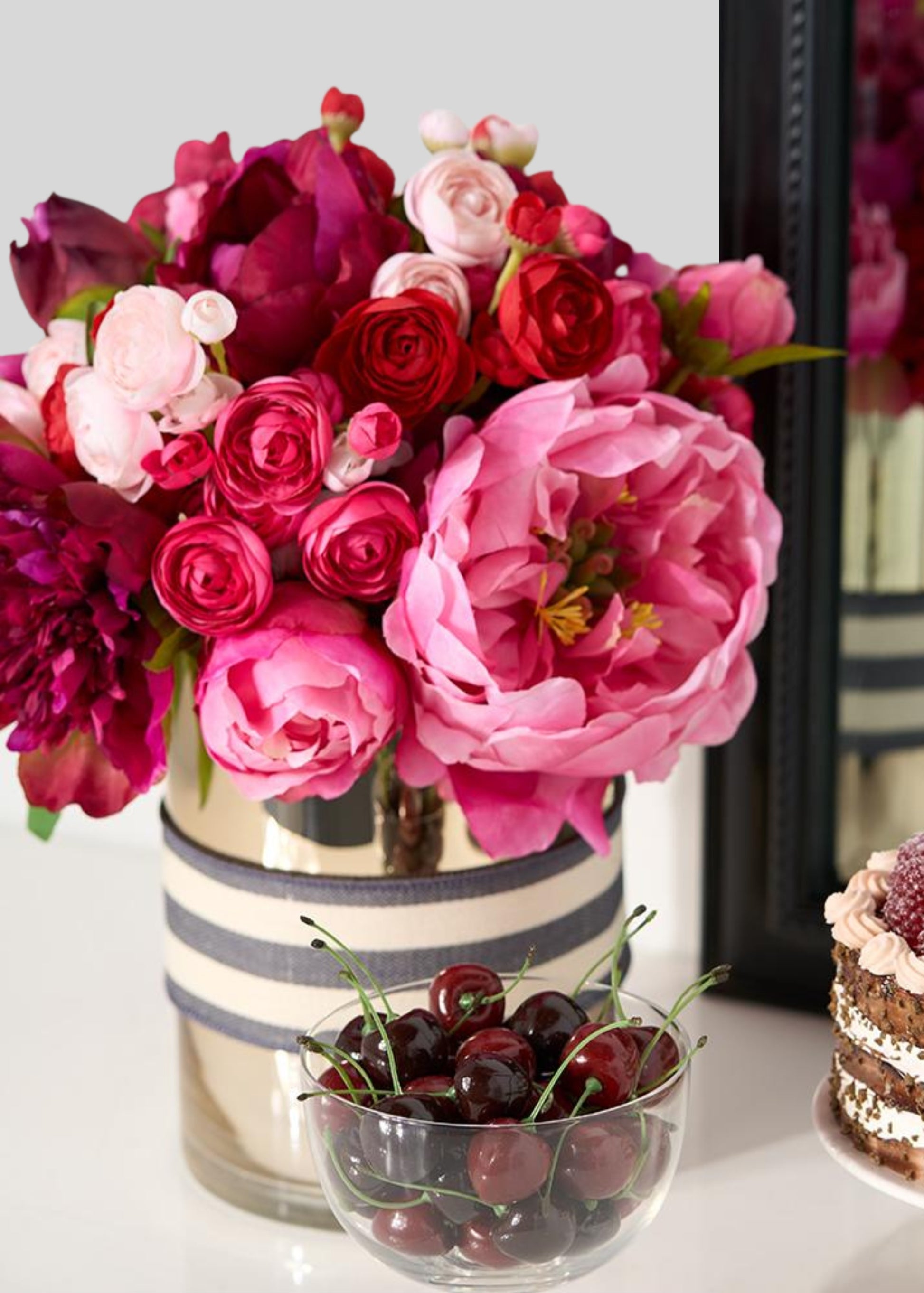 Bouquet of artificial red and pink ranunculus and peonies