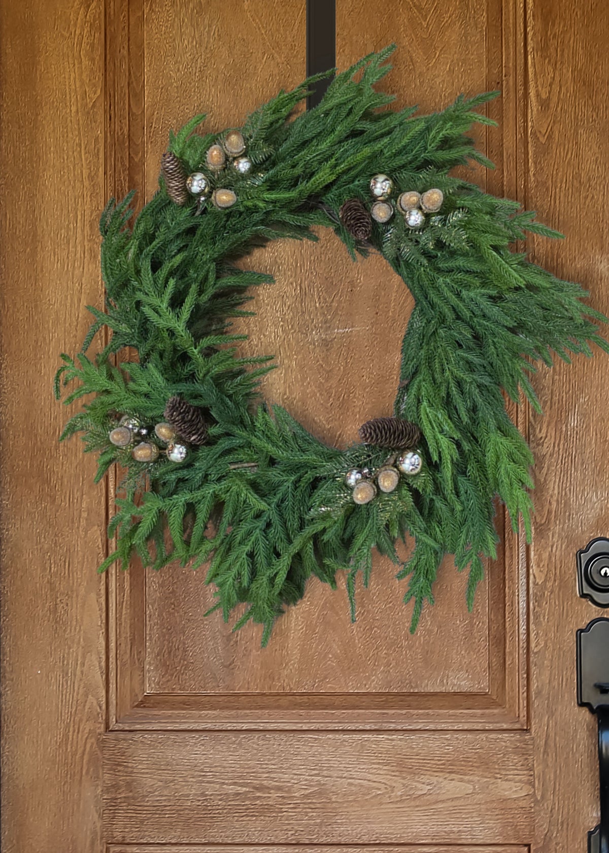 norfolk wreath with pine cones and beaded acorns