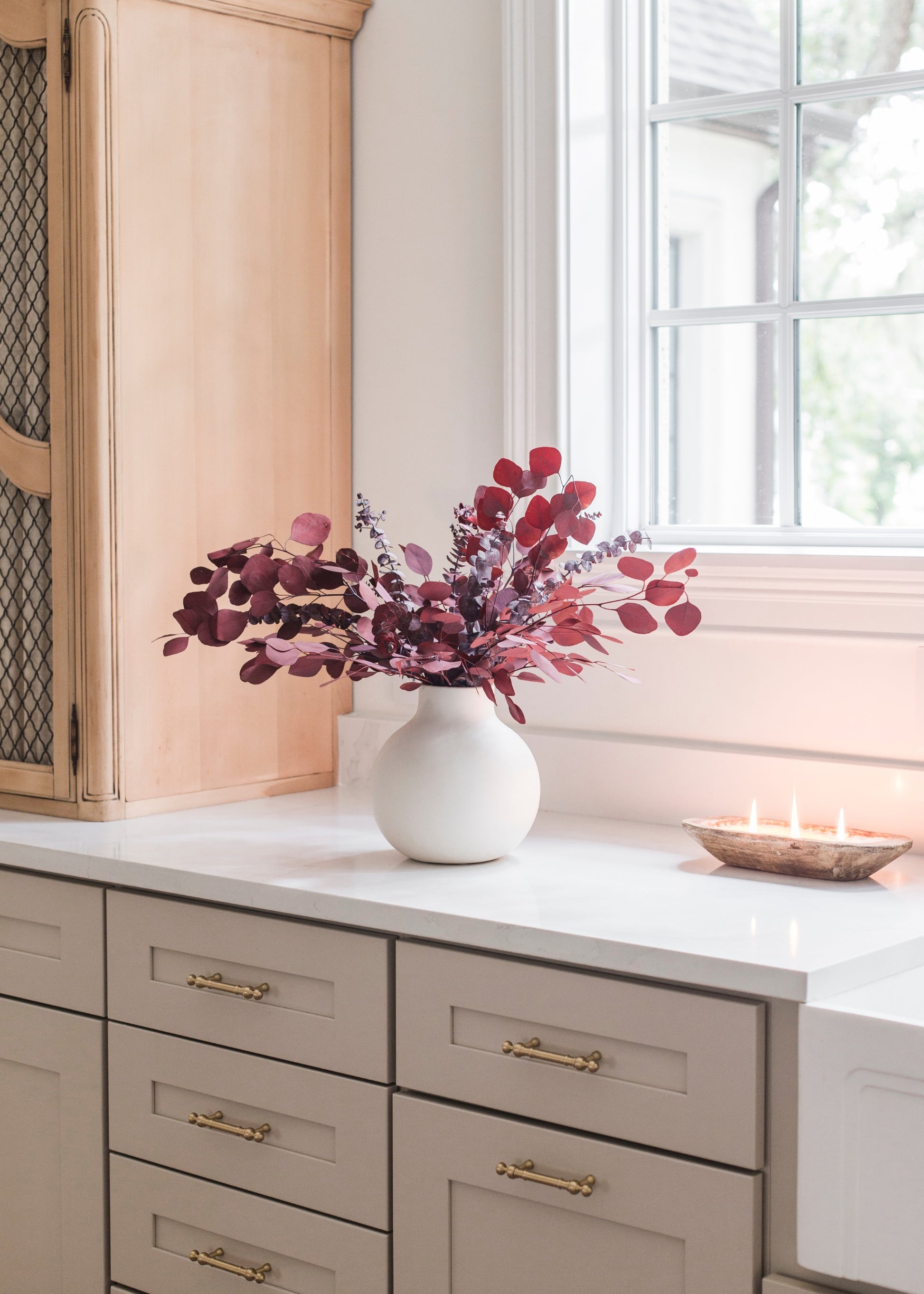 Vase of preserved red eucalyptus