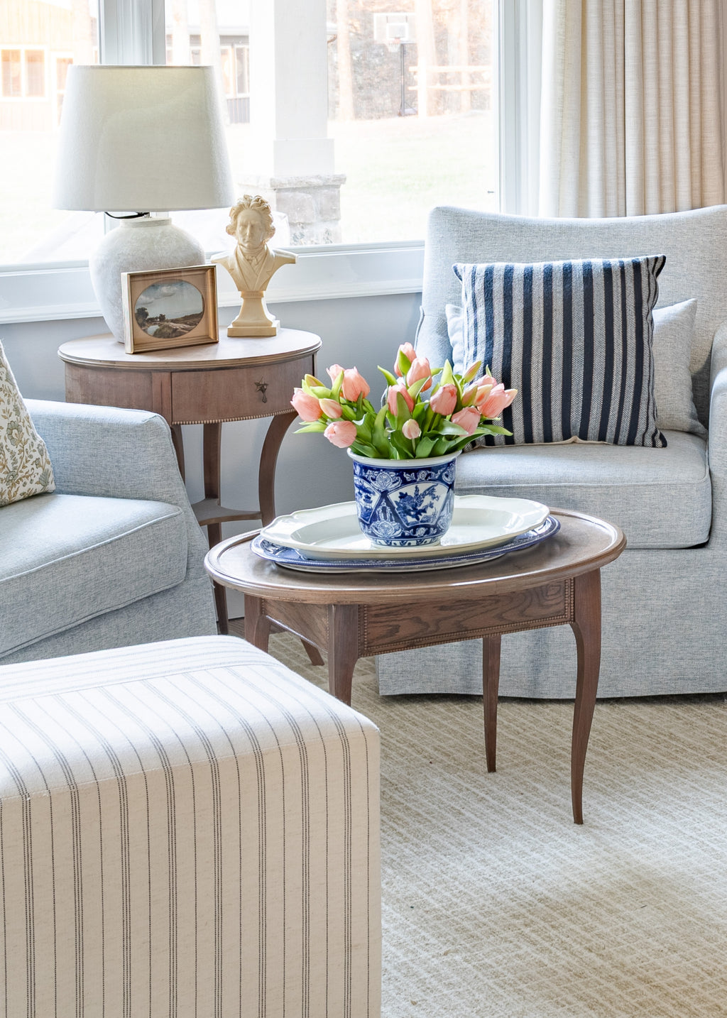 Living room with faux pink tulips on a wooden coffee table