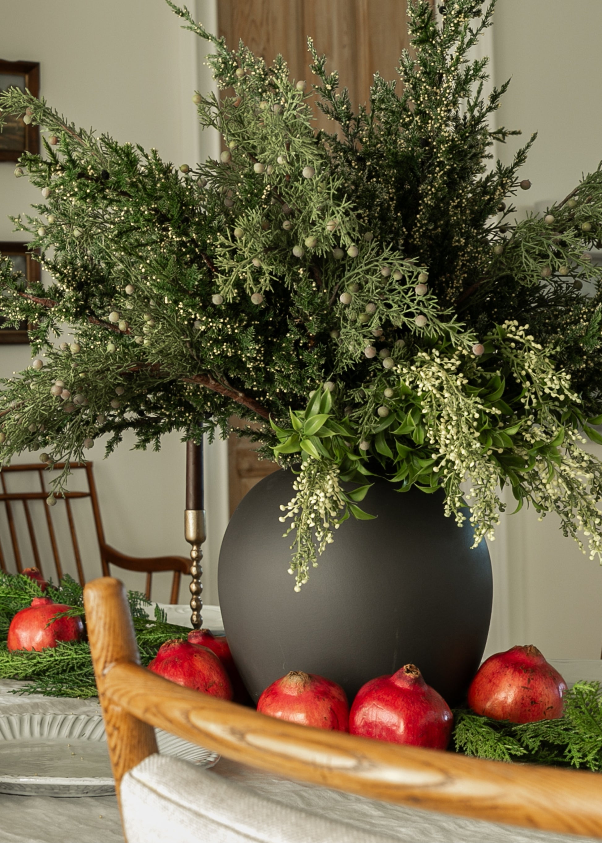 artificial greenery bush arranged in vase with faux evergreens
