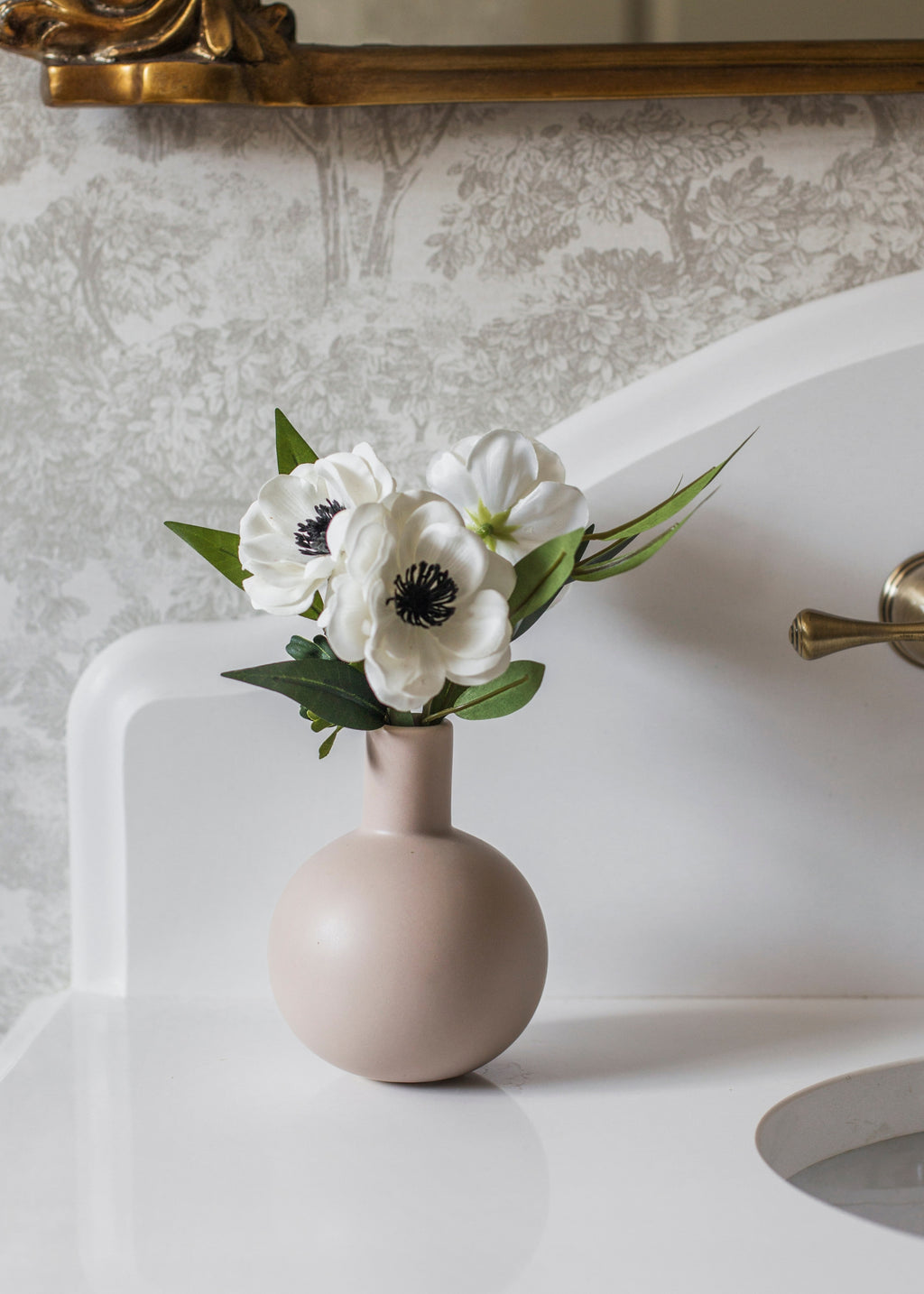 Anemones Arranged in Vase in Bathroom