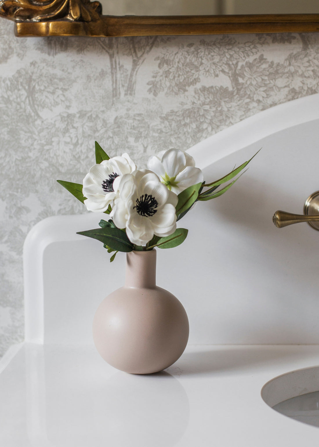Anemones Arranged in Vase in Bathroom