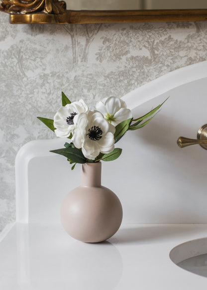 Anemones Arranged in Vase in Bathroom