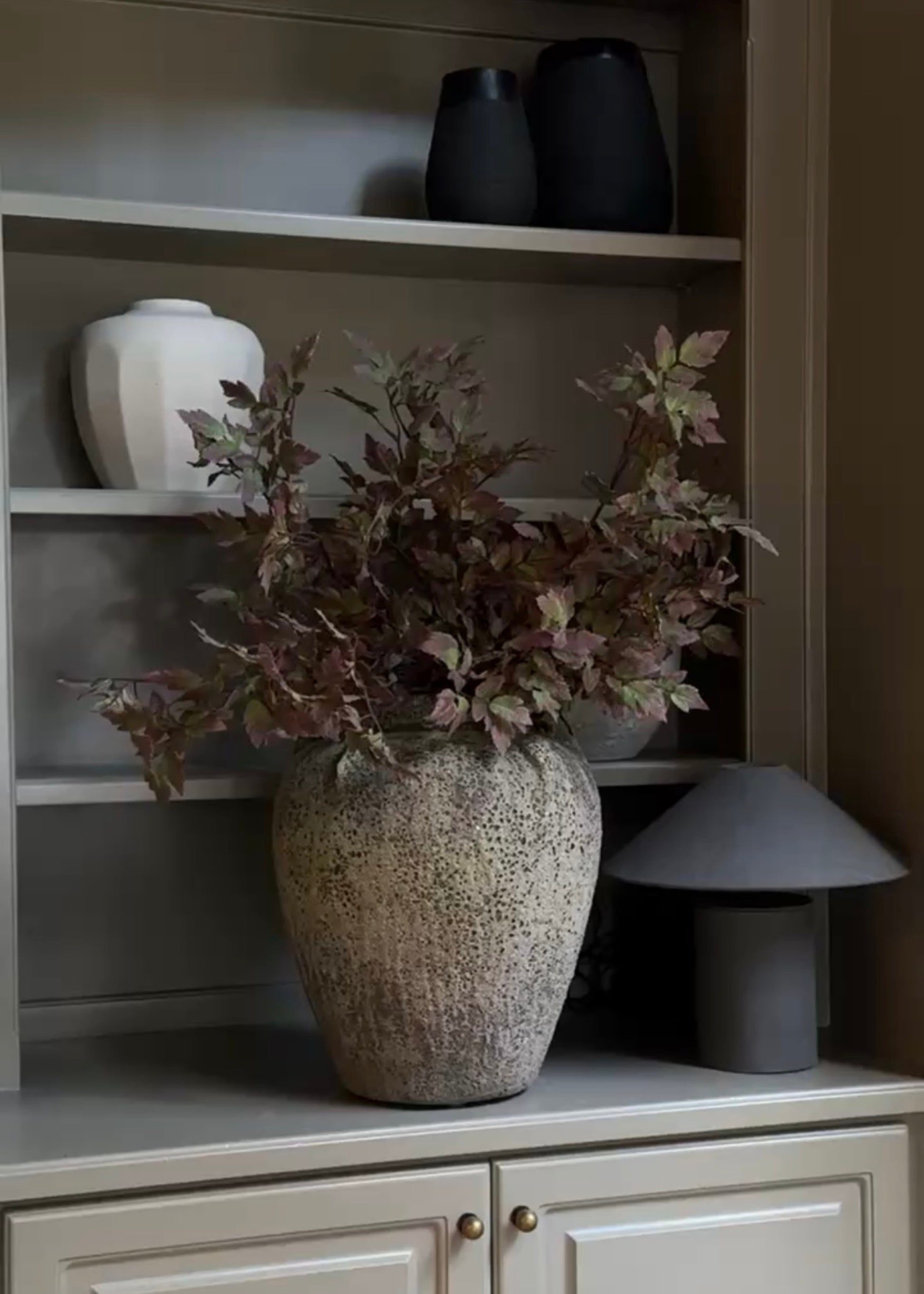 Purple and Green Fake Cimicifuga Stems Styled on a Shelf