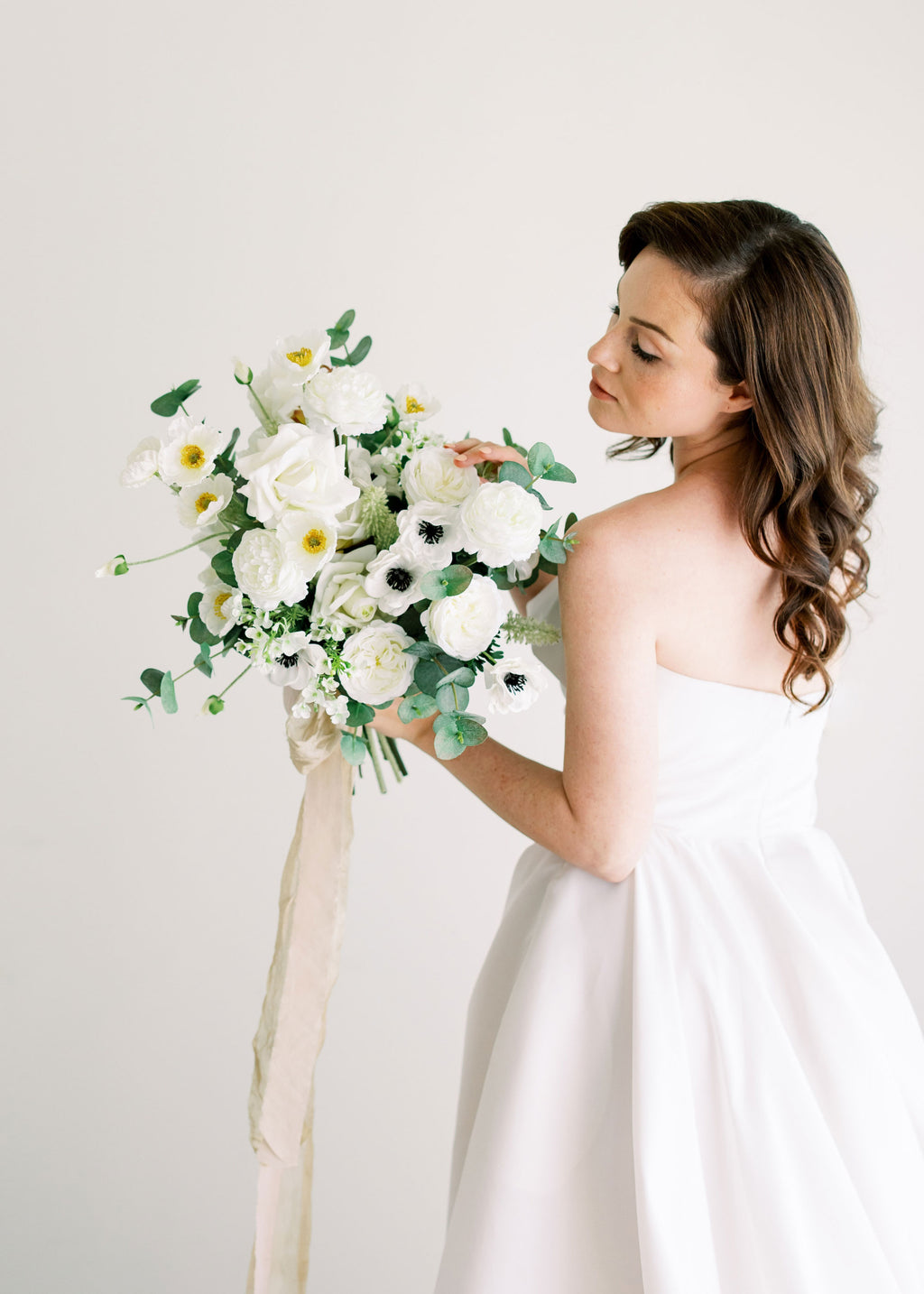bouquet of poppies, ranunculus, and anemones