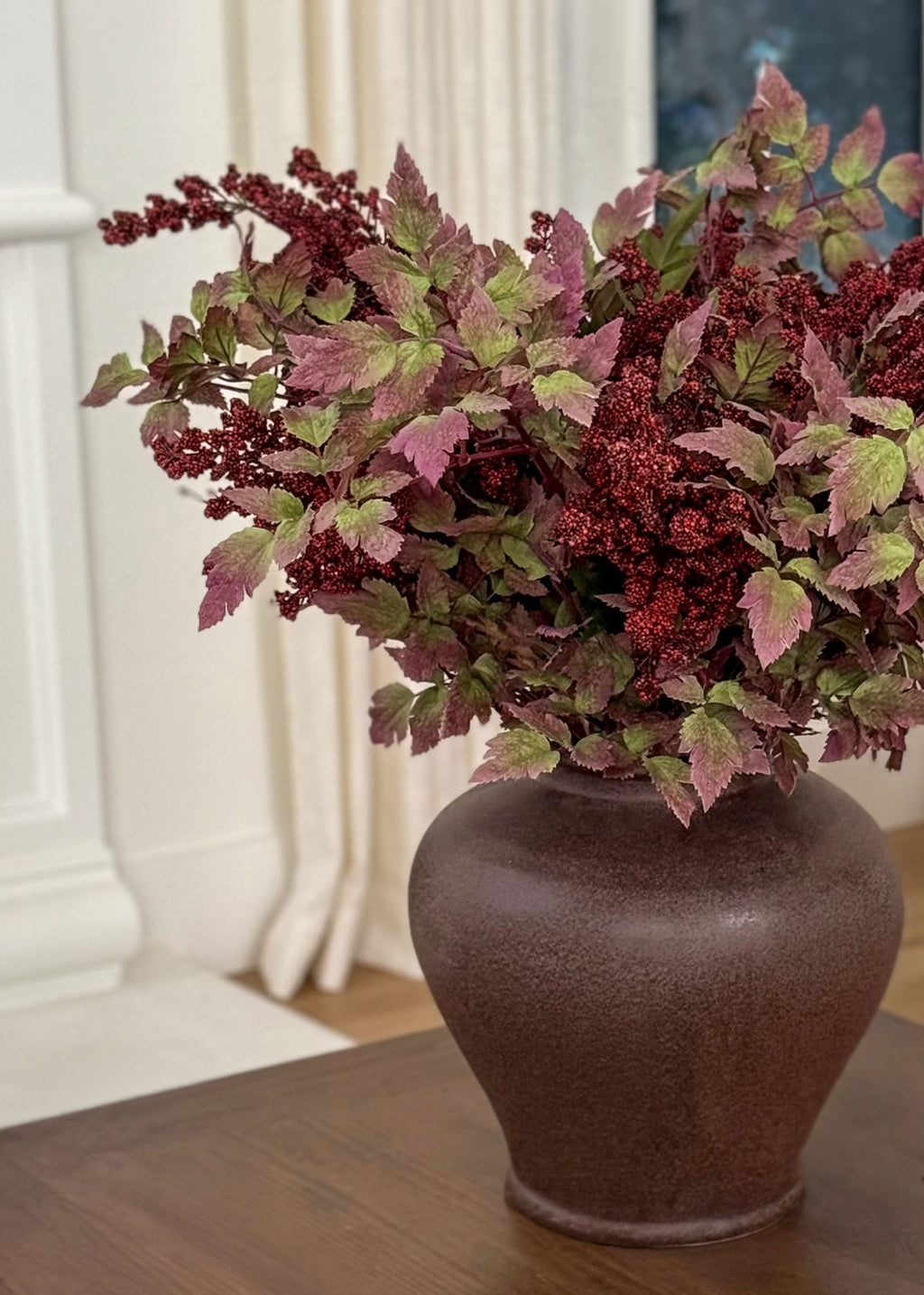vase styled with burgundy nandina and cimicifuga