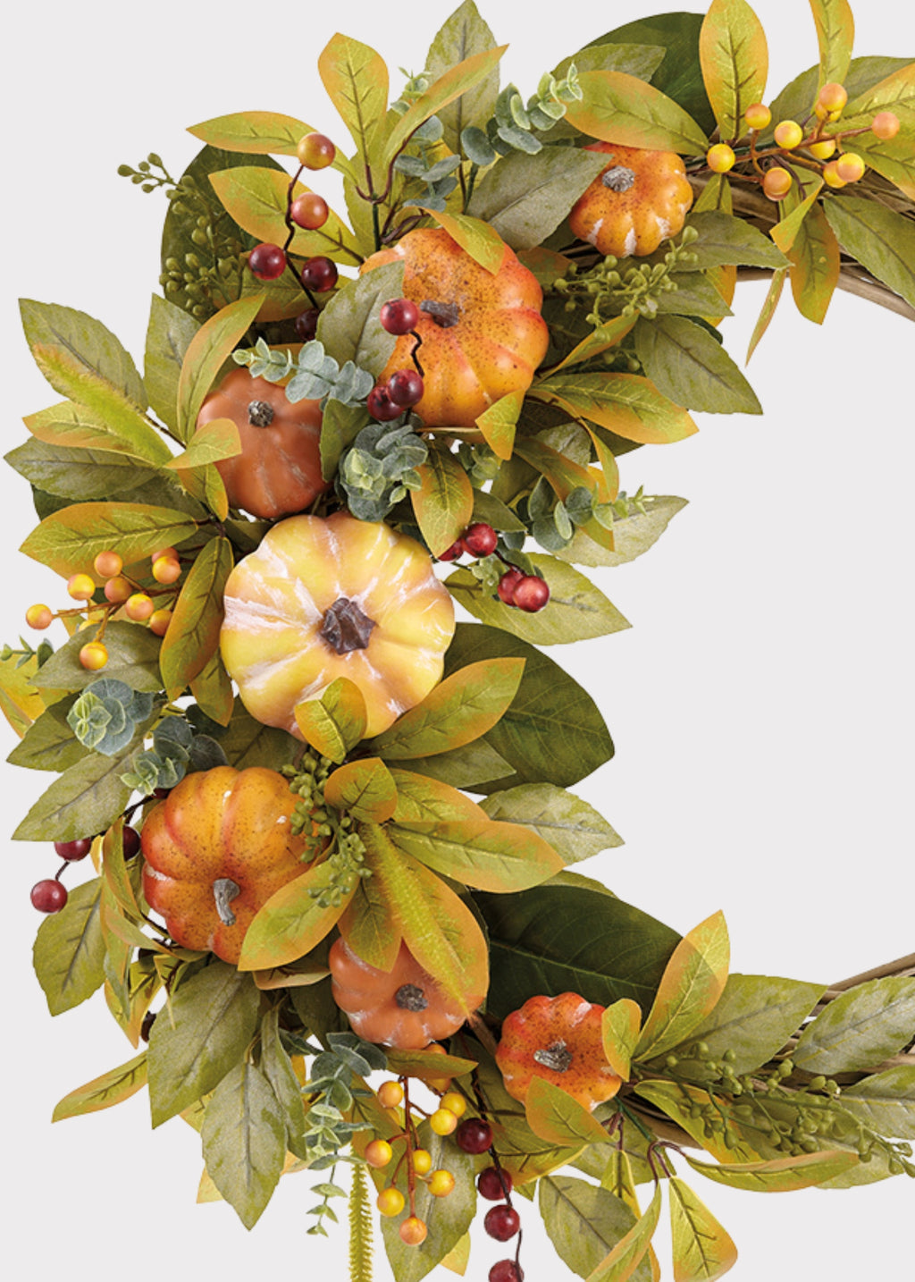 Close-up of a Orange Artificial Pumpkin and Foliage Autumn Wreath