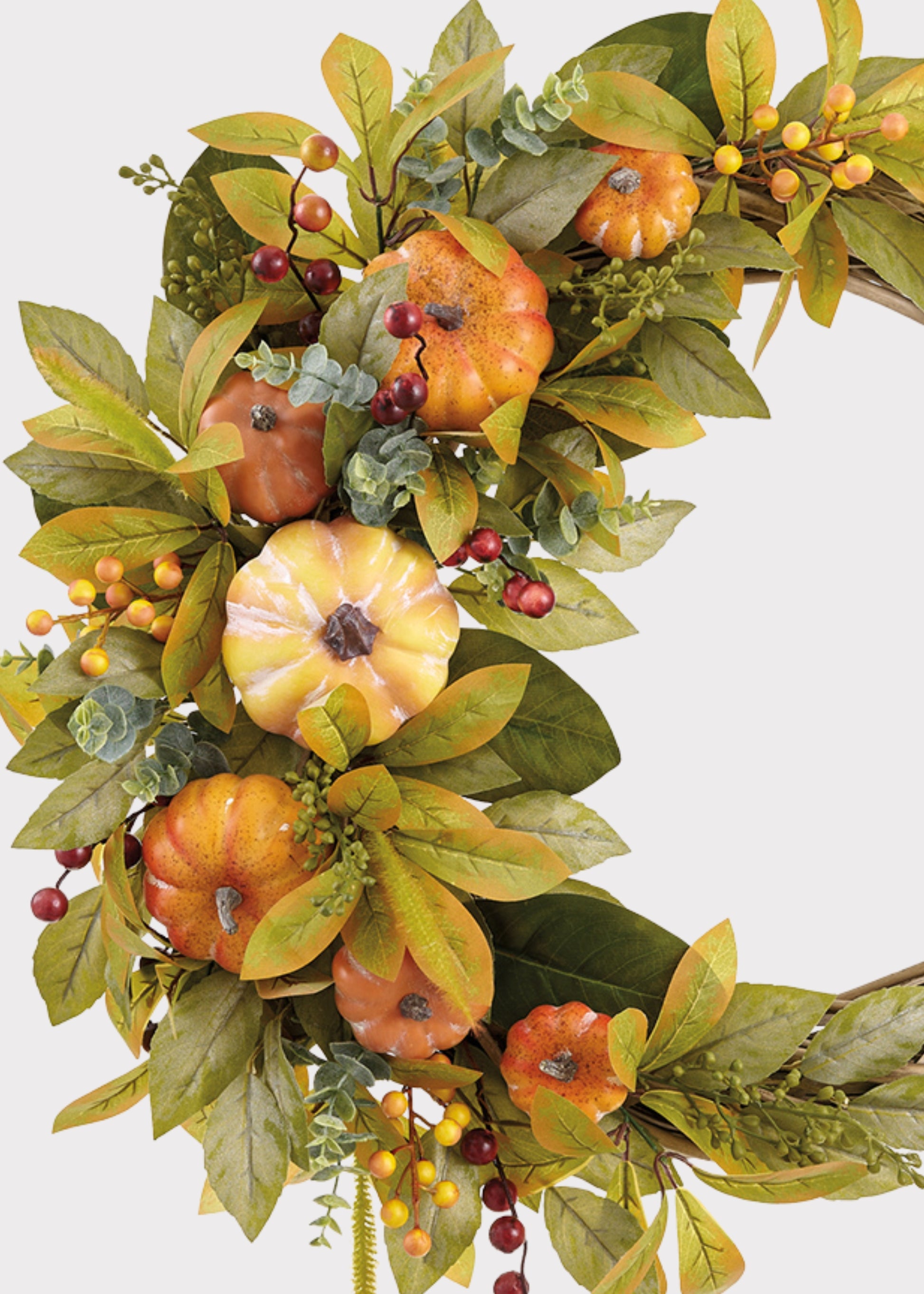 Close-up of a Orange Artificial Pumpkin and Foliage Autumn Wreath