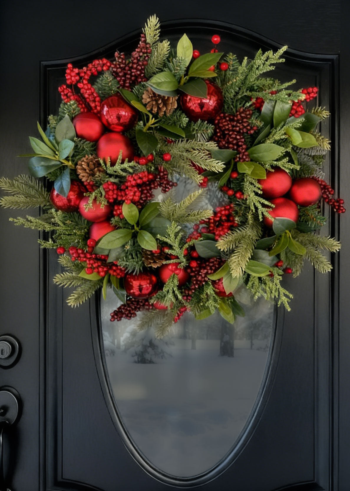 Holiday Pine Wreath with Red Ball Ornaments on a Black Door